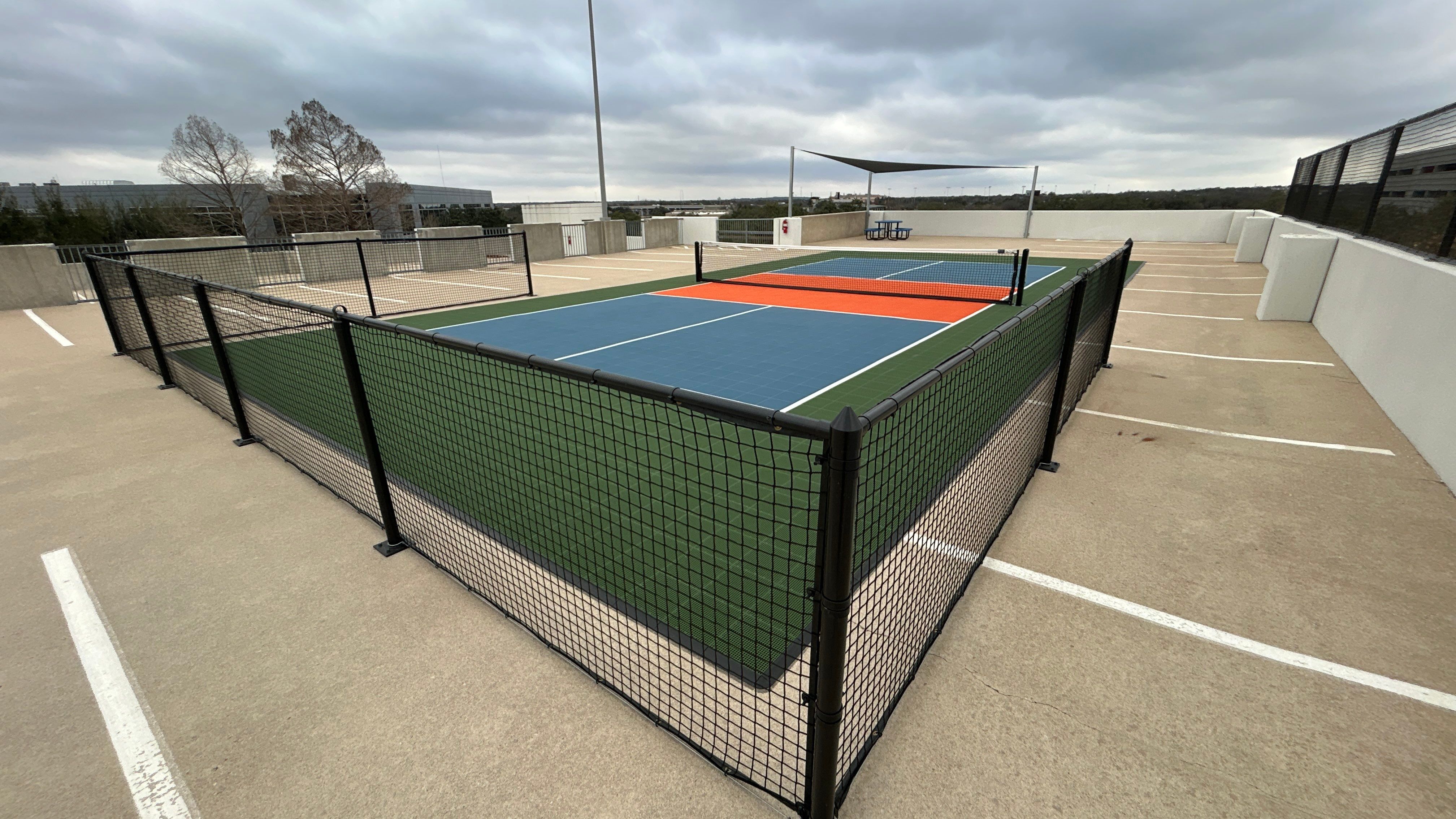 Travis Oaks Parking Garage by Sport Court Austin