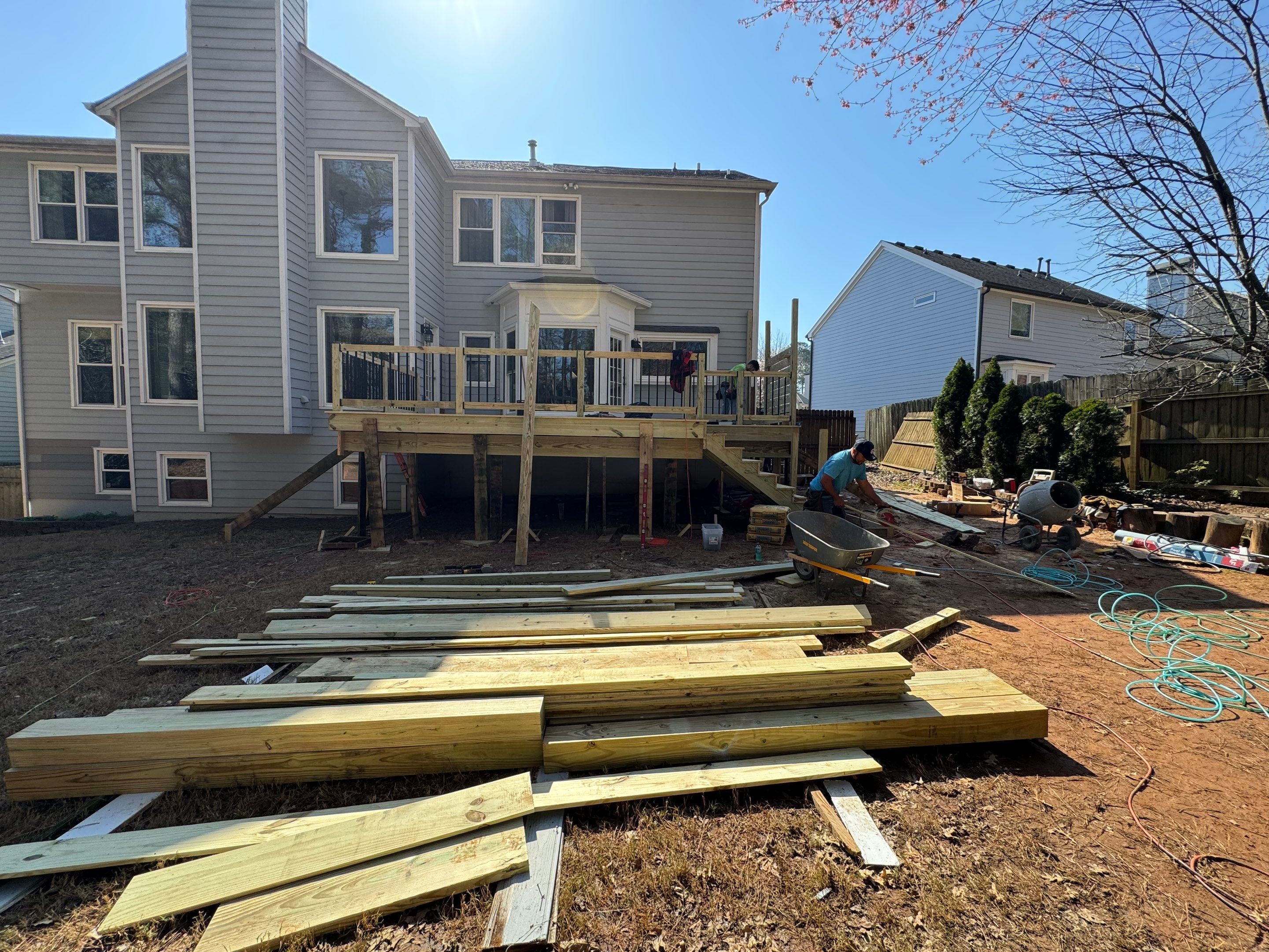 Elevated Deck Replacement with Black Metal Railings in Johns Creek by Swift Home Renovations