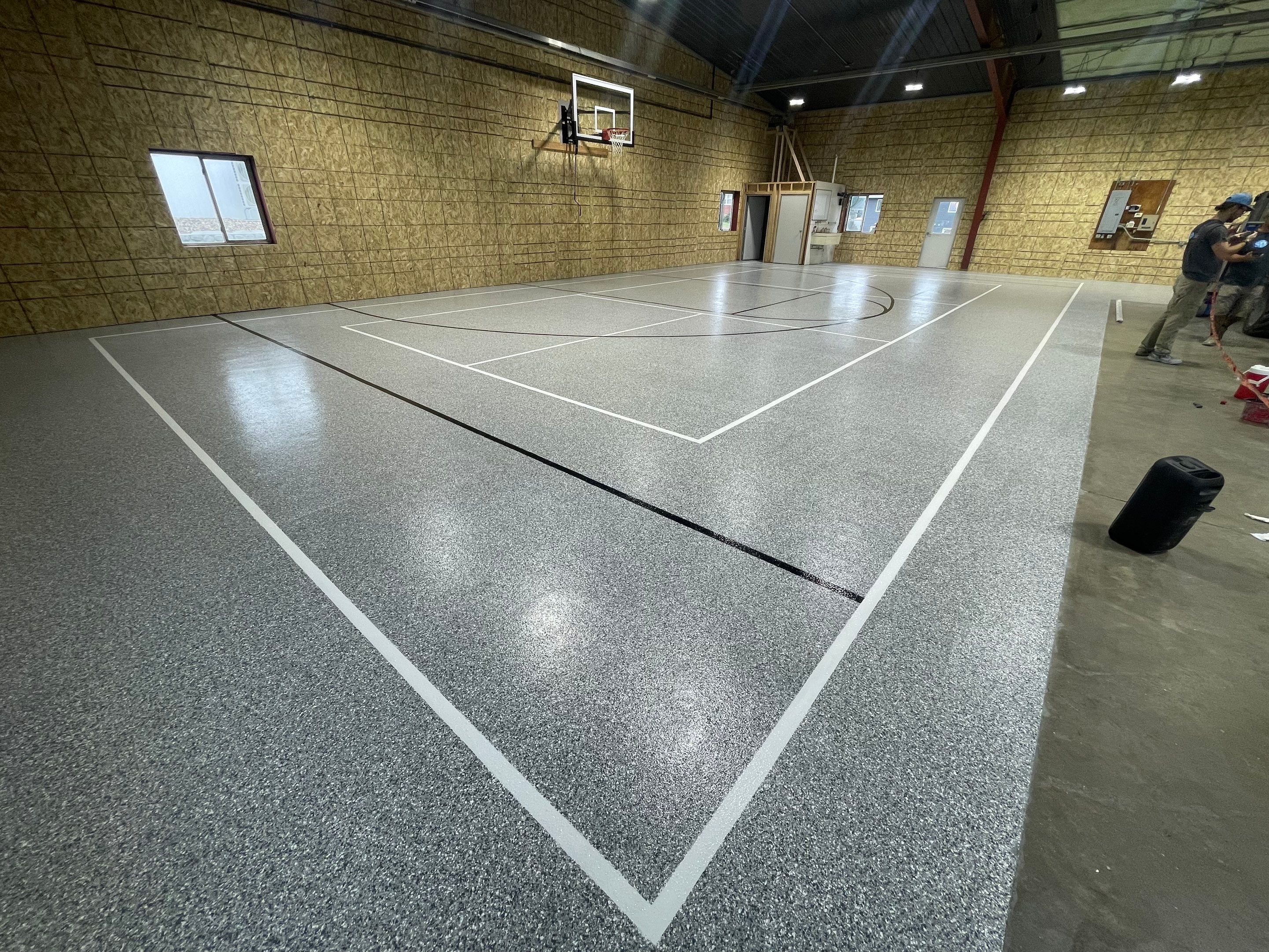Custom Polyurea Shop Floor with Basketball Court Lines in Rock Valley by Select Painting, Coatings & Garage Cabinets