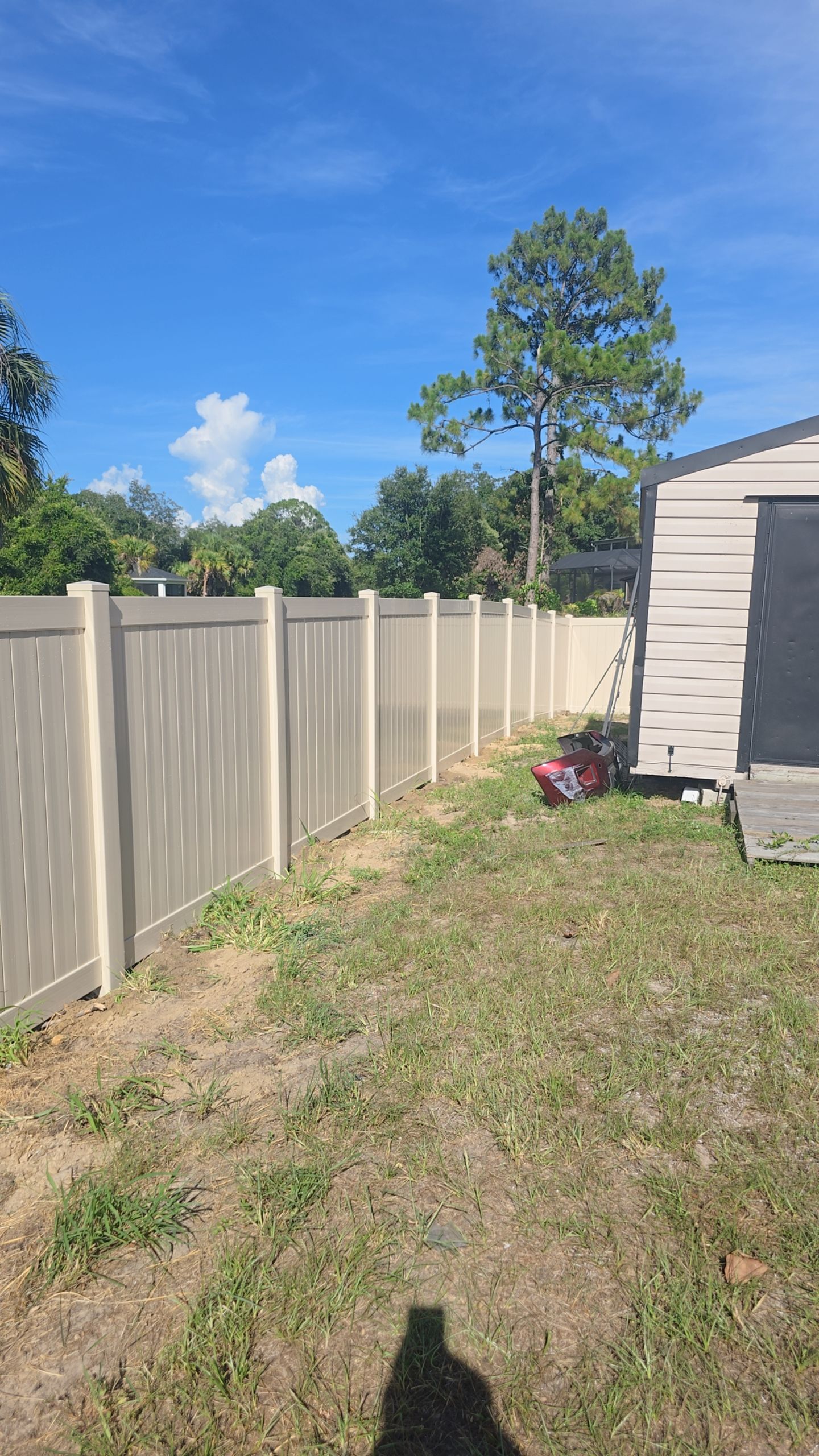 Tan Vinyl Privacy Fence and Gate Installation in North Port by True Fence LLC