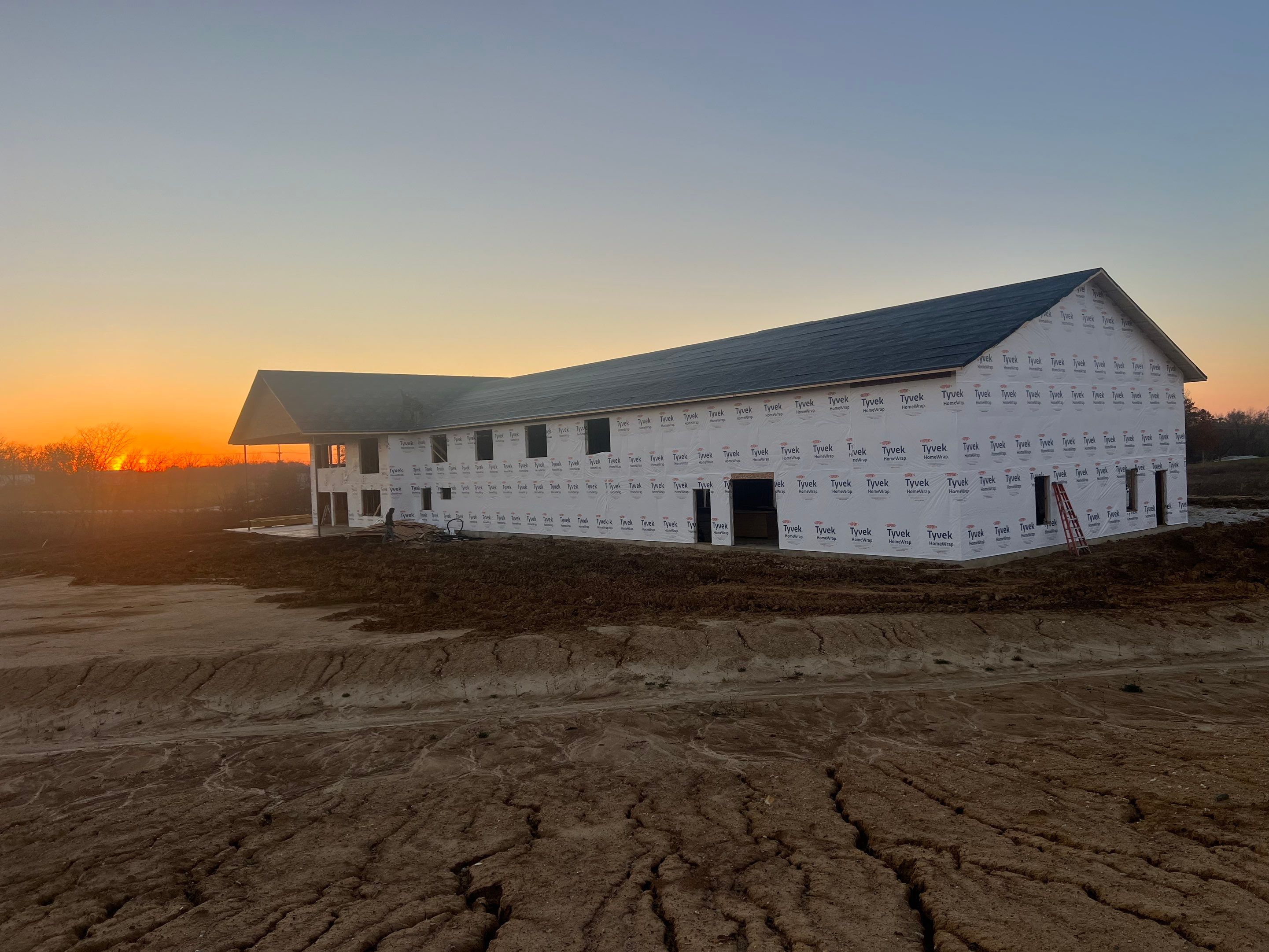 New Home construction w/ board and batten sides and metal roof  by Miles Construction 