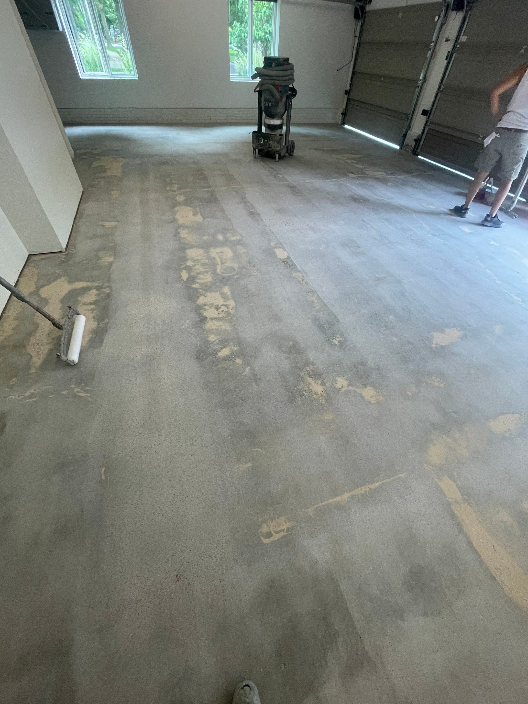 Gray Speckled Epoxy Garage Floor Coating in Sioux Falls by Select Painting, Coatings & Garage Cabinets