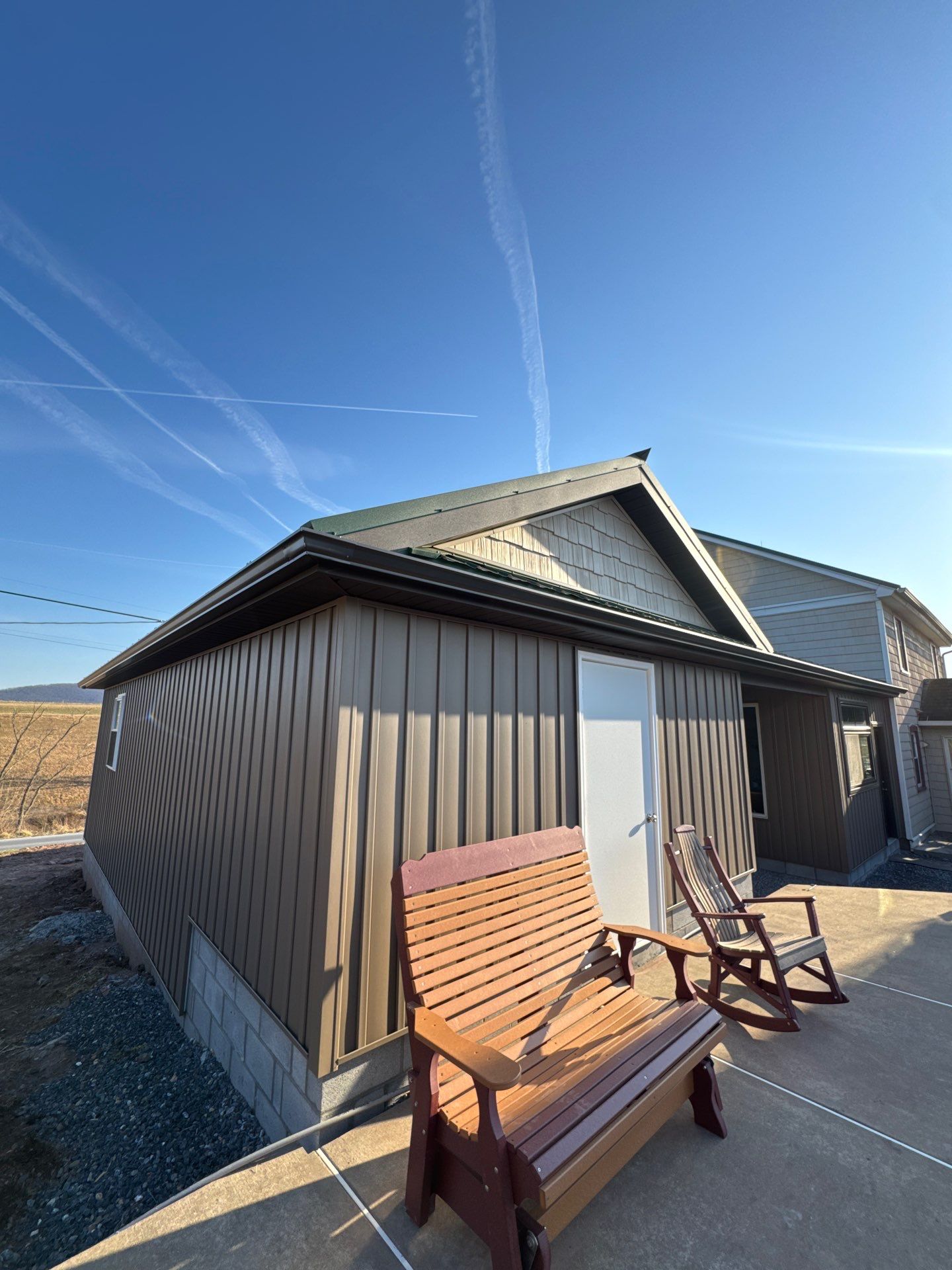 Multi-Story Residential Addition Featuring Textured Metal Siding in Millersburg by Esh Builders