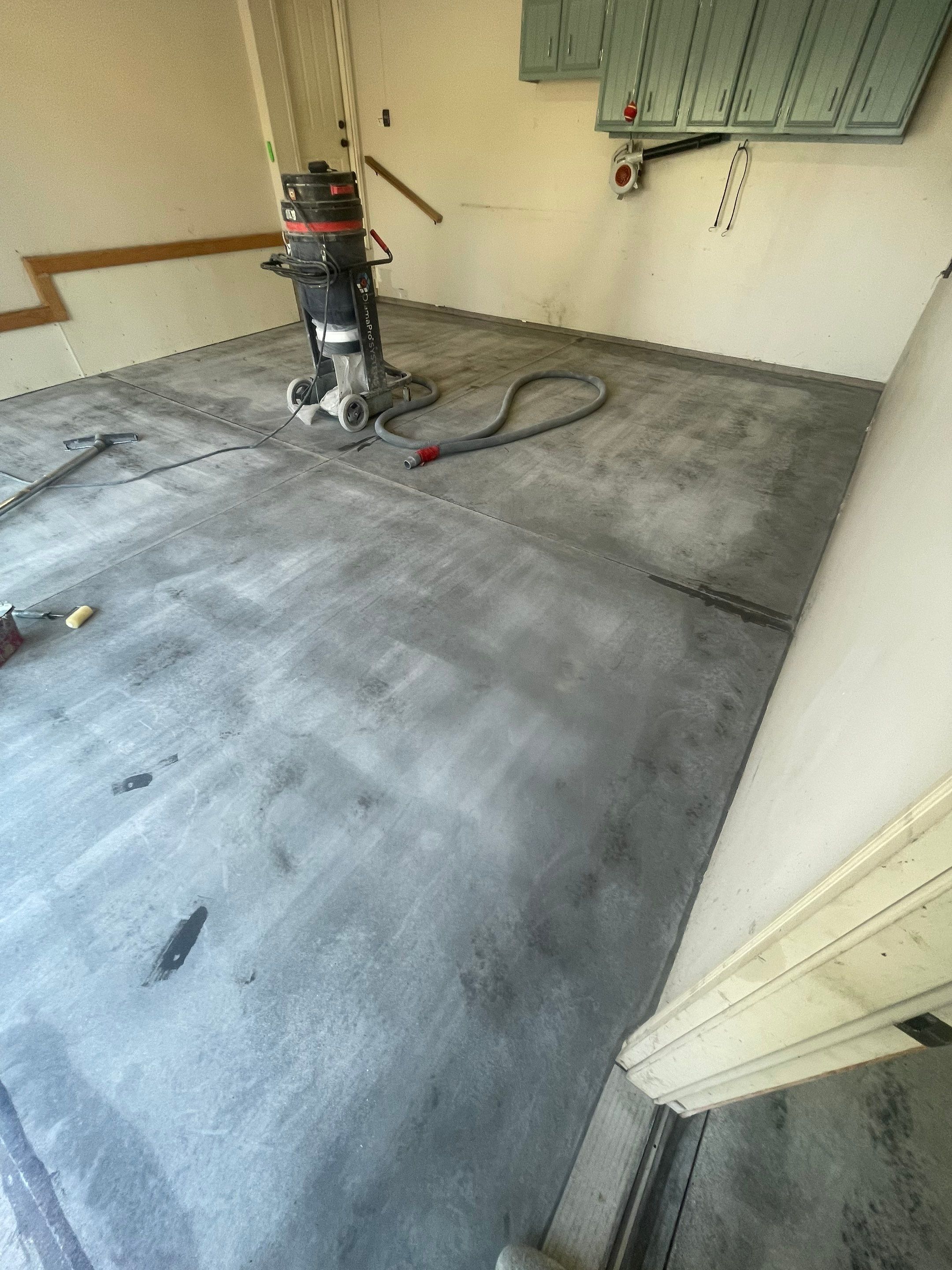 Multi-Stall Garage Floor Coating Installation in Sioux Falls by Select Painting, Coatings & Garage Cabinets