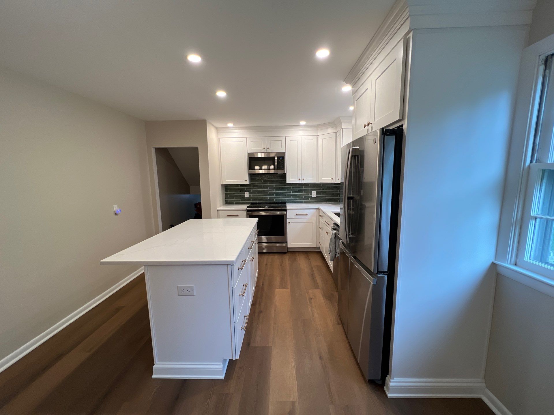 Phoenixville Kitchen Remodel with White Shaker Cabinets and Green Backsplash by Reliable General Contracting