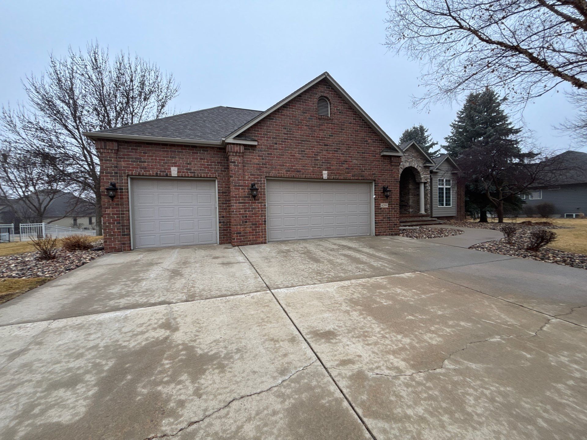 Sioux Falls Concrete Driveway Replacement and Custom Front Walkway by Select Painting, Coatings & Garage Cabinets
