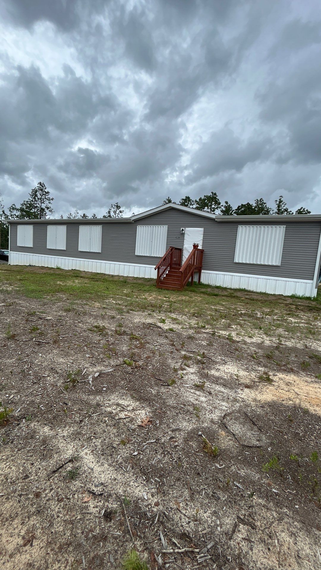 Residential Accordion Hurricane Shutter Installation in Fountain, Florida by Brannan Aluminum Inc.