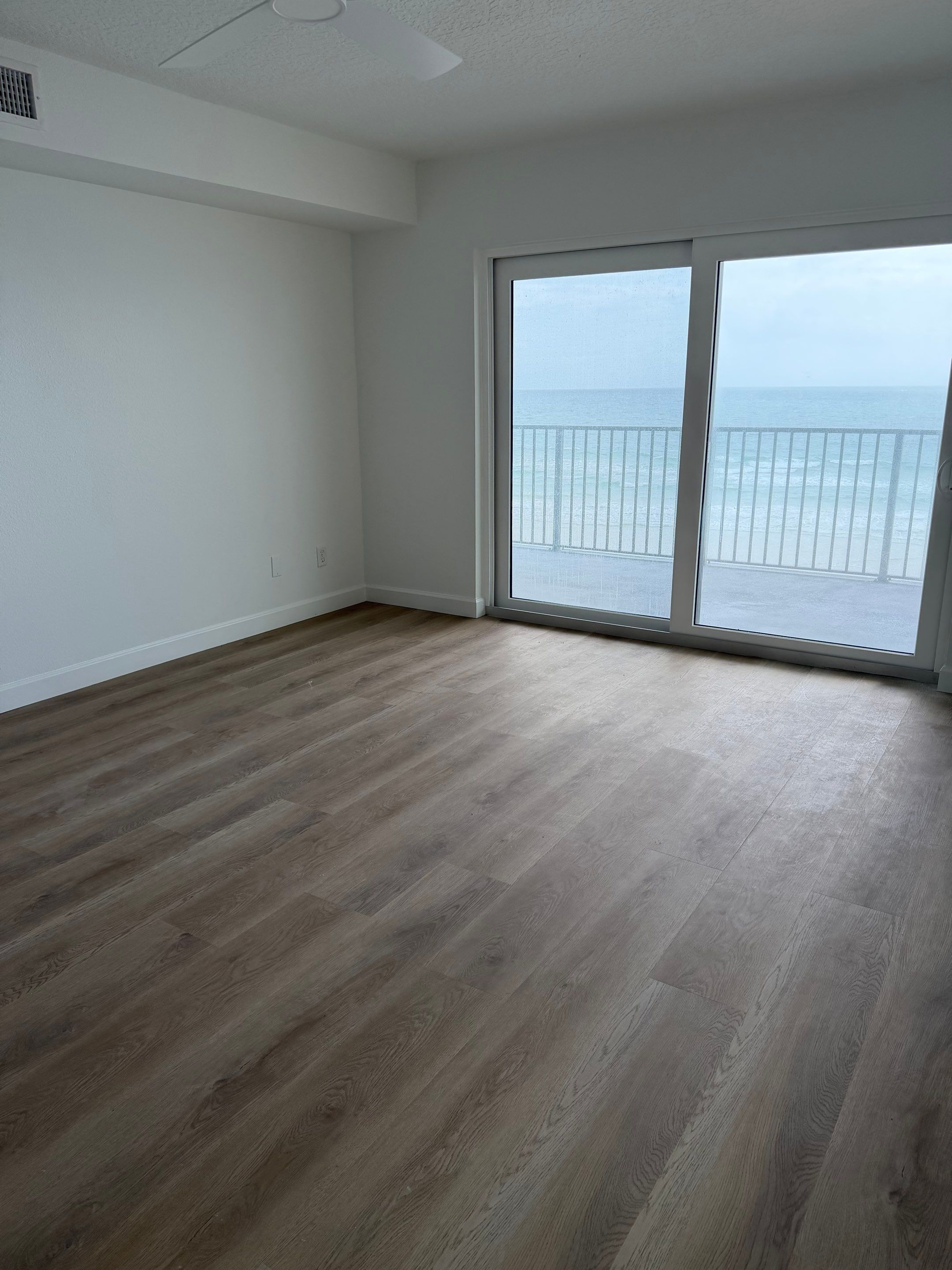 Full Condominium Remodel Featuring Aubrey Oak Flooring In Daytona Beach by Acies Renovations