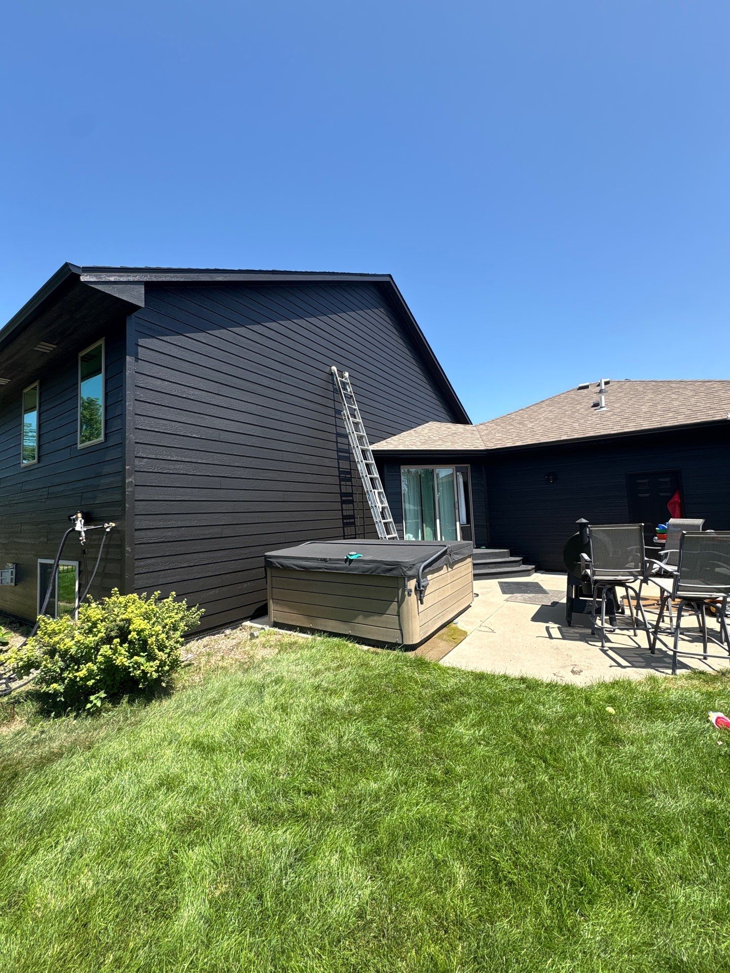 Full Exterior Siding Repaint for Sioux Falls Home and Garage by Select Painting, Coatings & Garage Cabinets