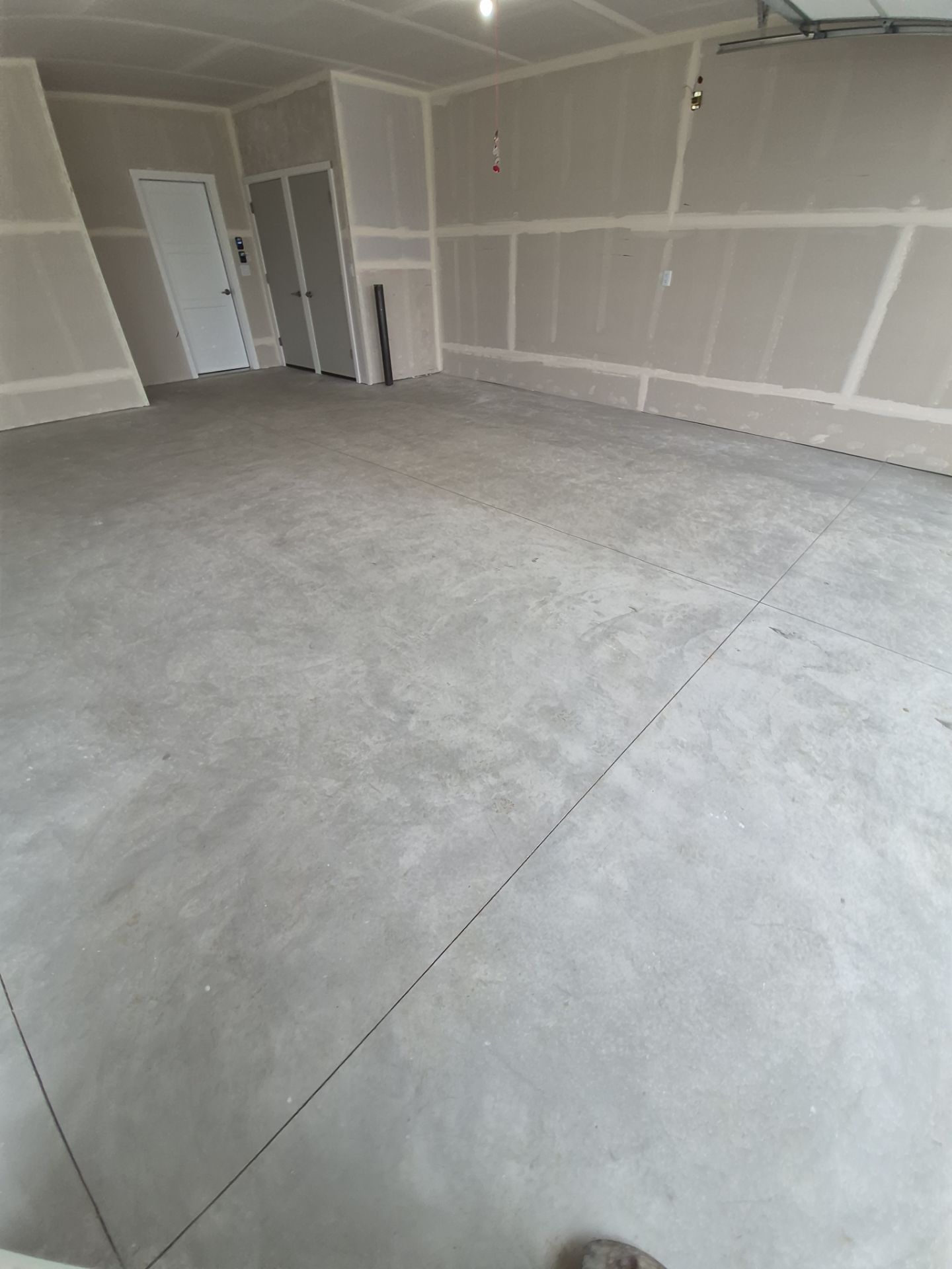 Coeur d'Alene New Construction Garage Floor Coating in Pebble Beach by Croc Coatings, LLC