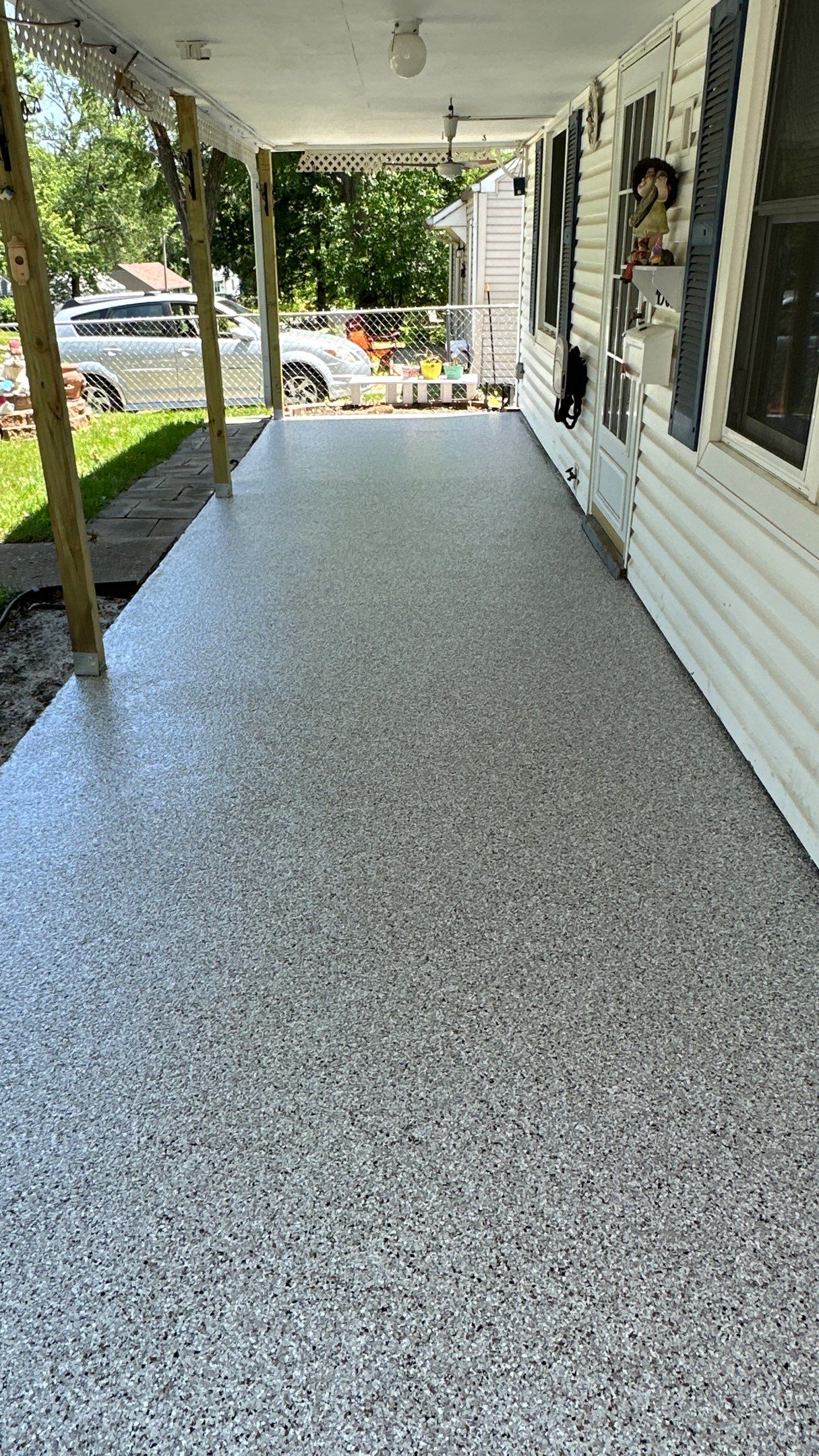 Look at this beautiful Coyote flake floor on this patio by Banner Garage