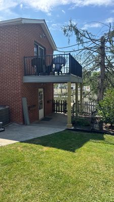 Elevated Composite Deck Rebuild with Black Metal Railing in Lewisburg