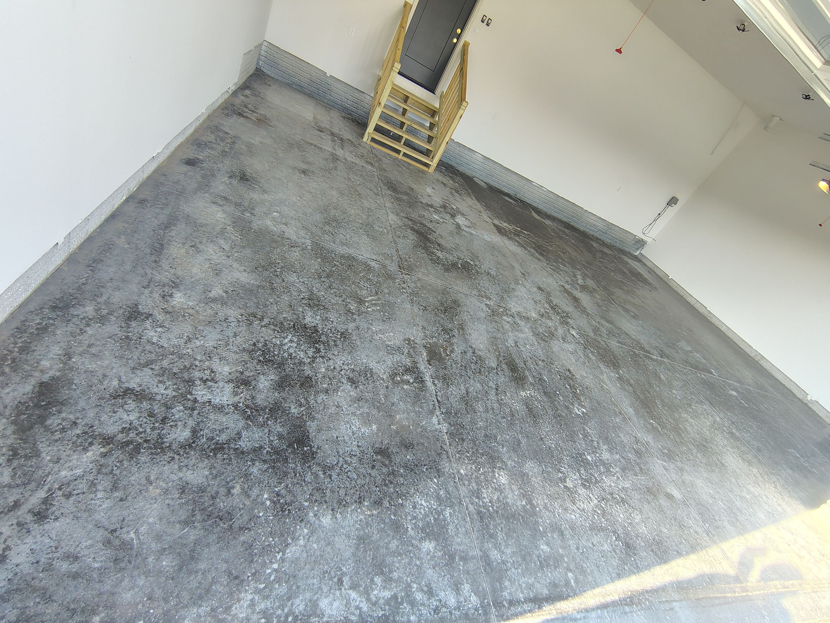 Cabin Fever Decorative Flake Garage Floor Coating in Sioux Falls by Select Painting, Coatings & Garage Cabinets
