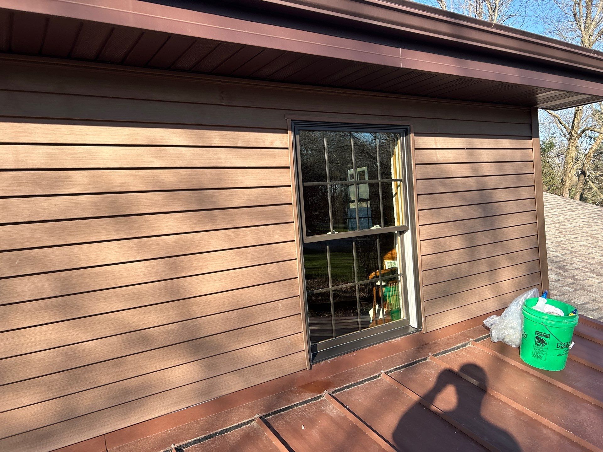 Pella Window installation using Pella Lifestyle wood/Aluminum window by United Windows and Siding LLC