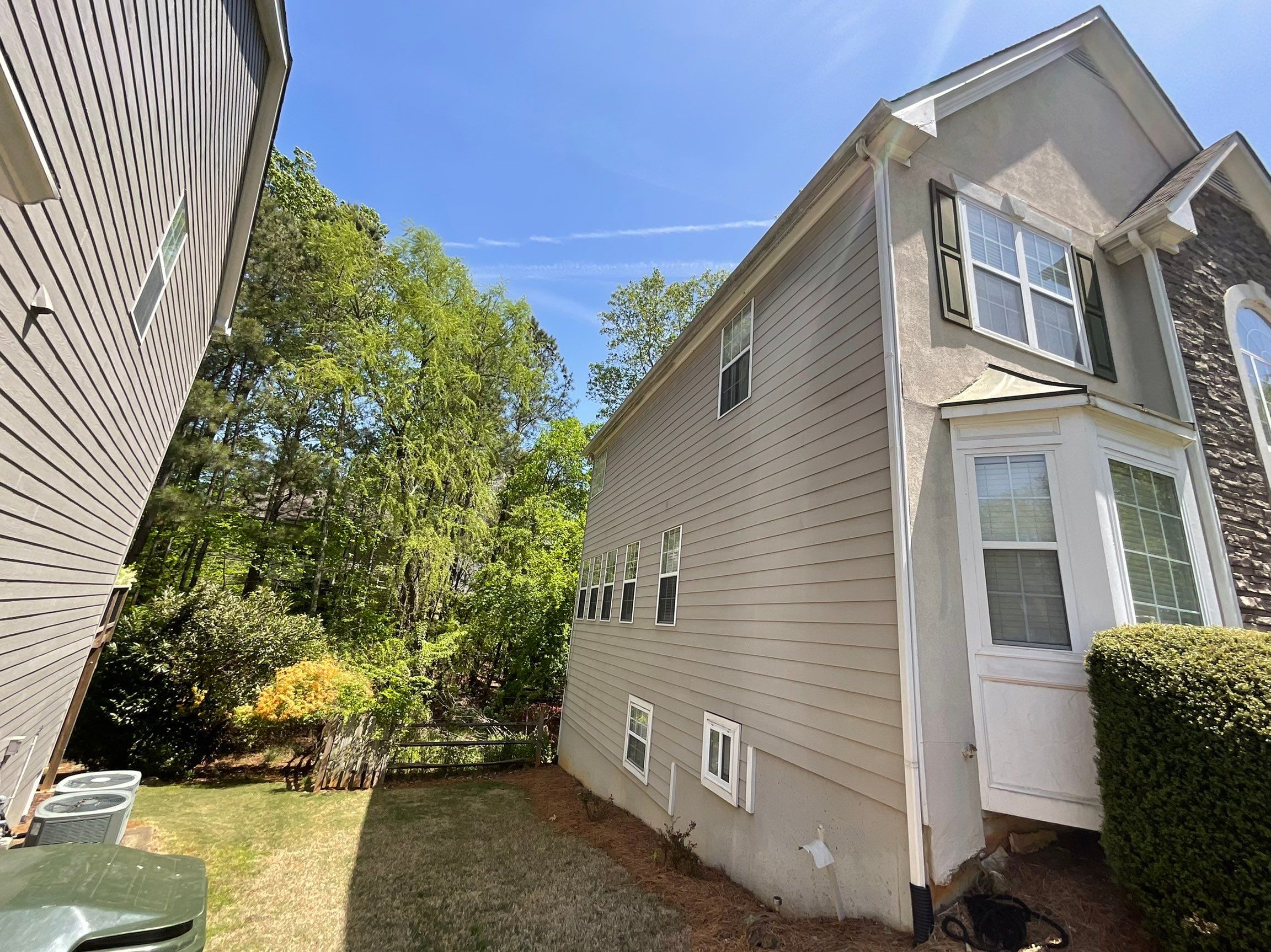 Stucco and Siding Exterior Painting with New Gutters in Kennesaw by Swift Home Renovations