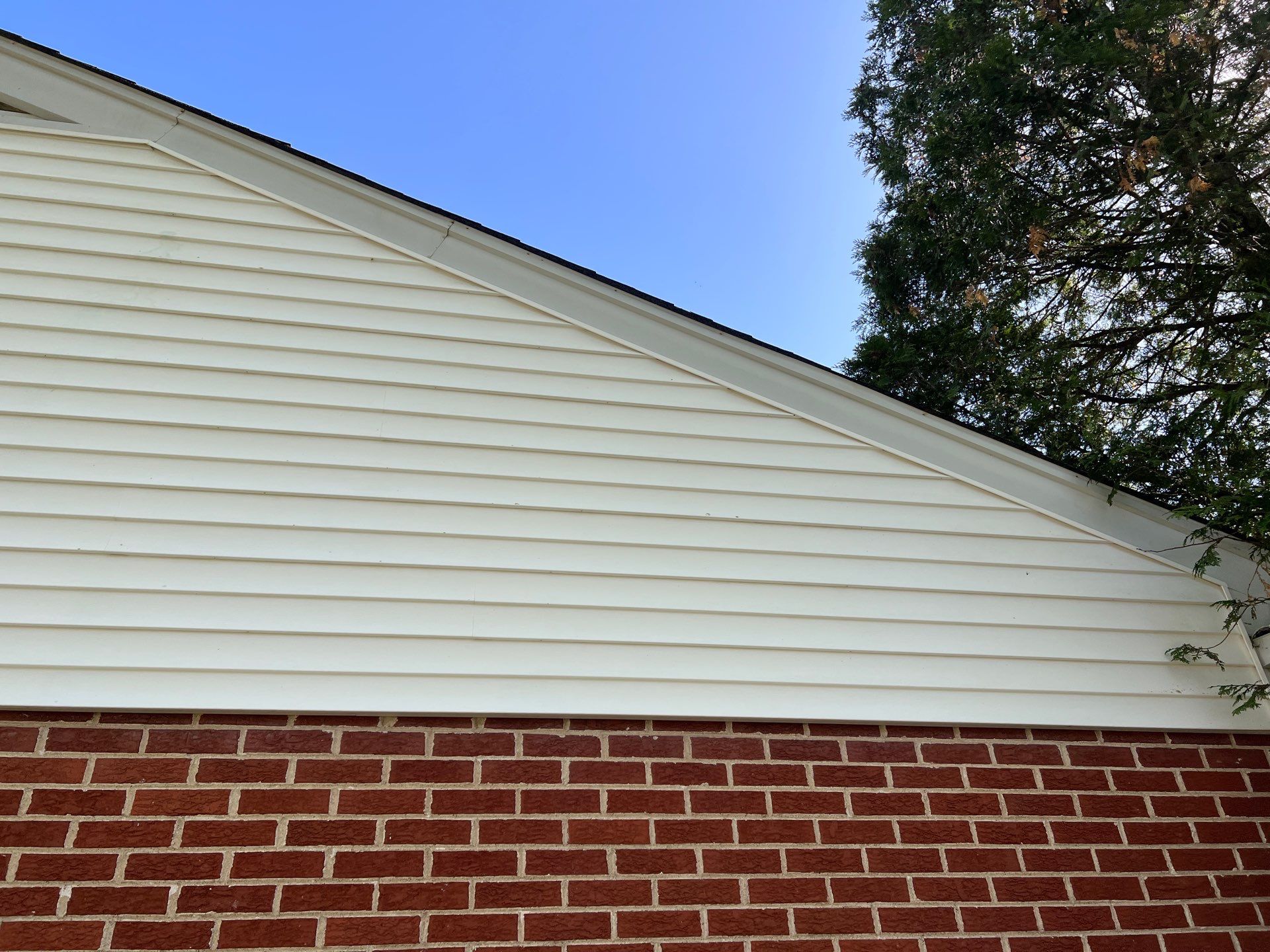 Housewashing  using Algaecide, soft wash soap by Northern Power Washing LLC.