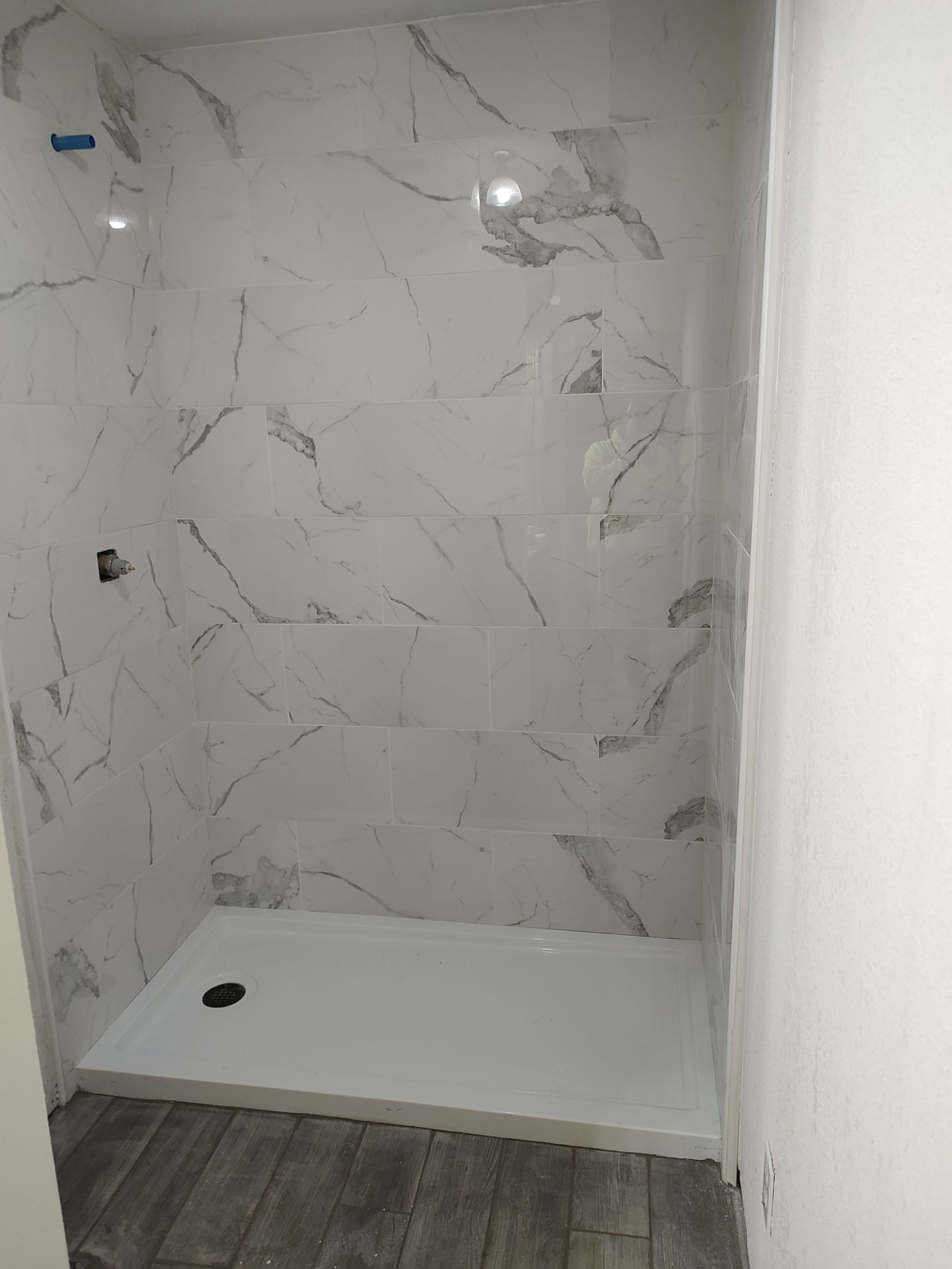 Bathroom remodel w/shower upgrade by In & Out Construction & Remodeling, LLC