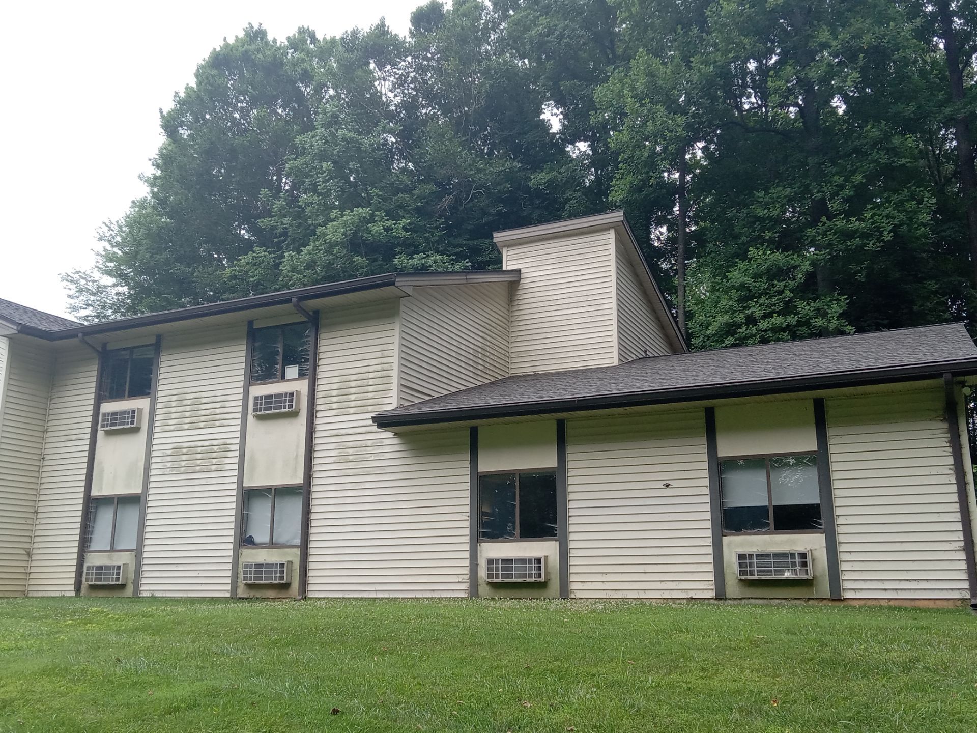 pressure washing exterior siding to remove dirt and mildew restoring appearance