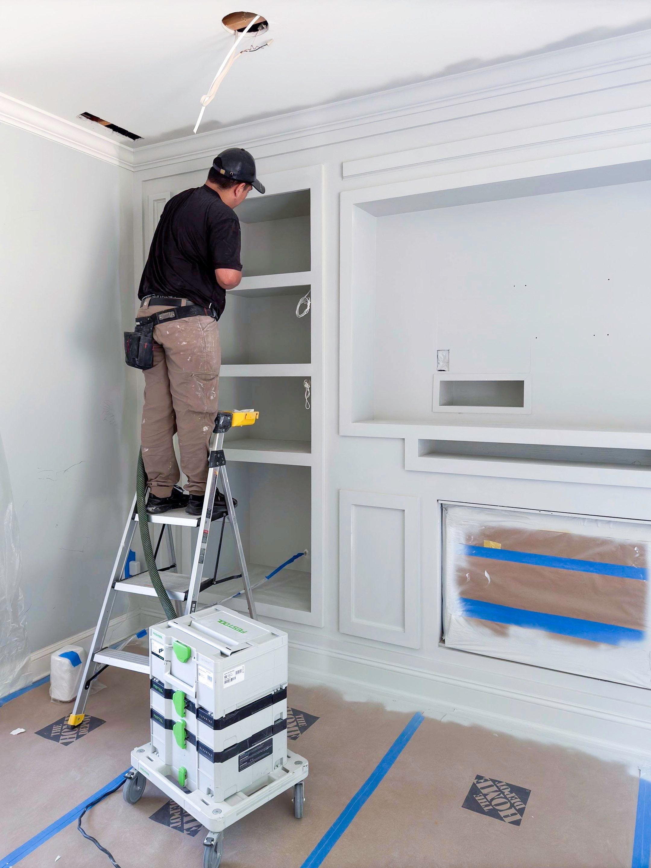 Built-in TV unit by Trendy Walls Inc.