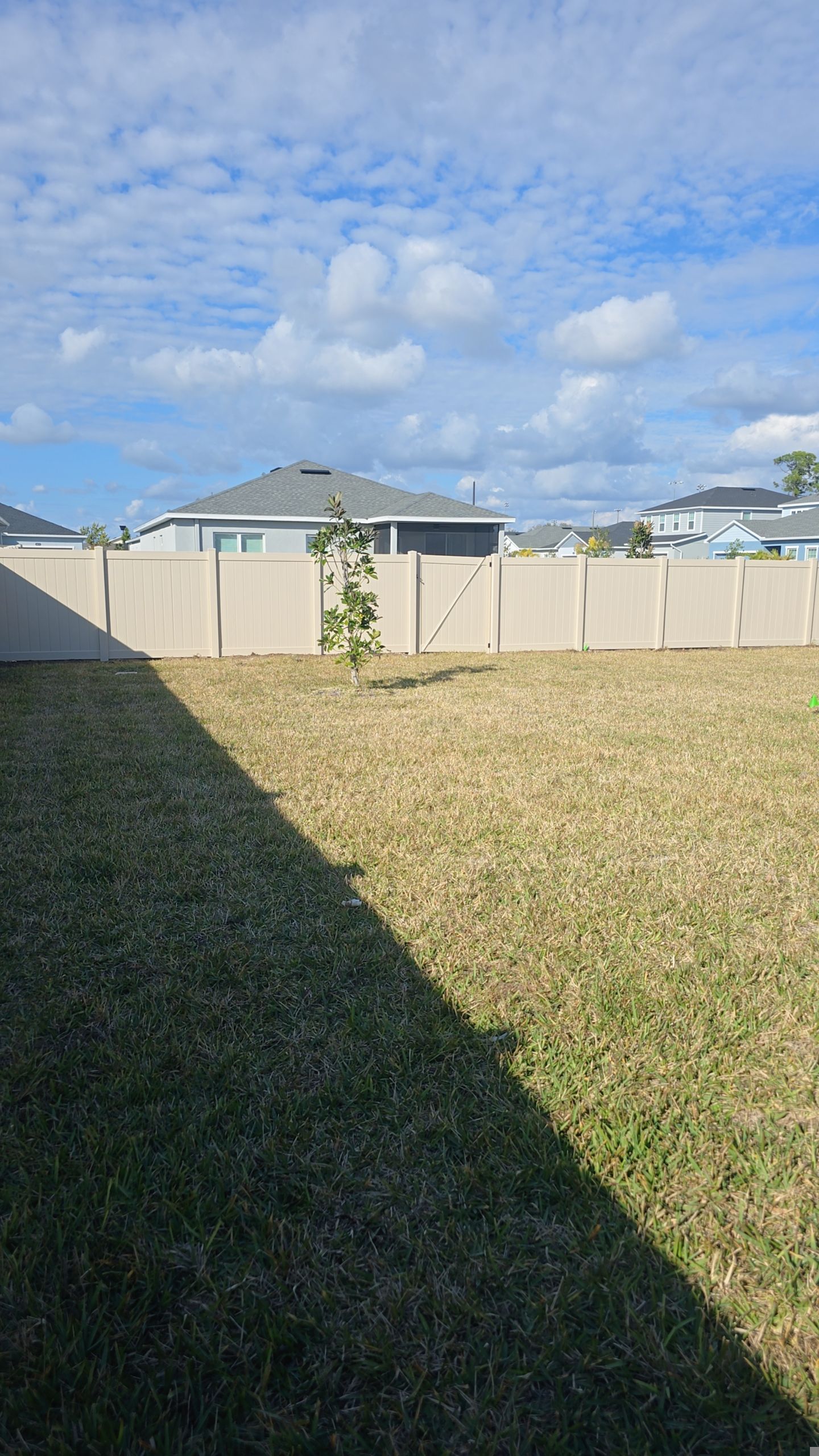 Tan Vinyl Fence in West Port by True Fence LLC