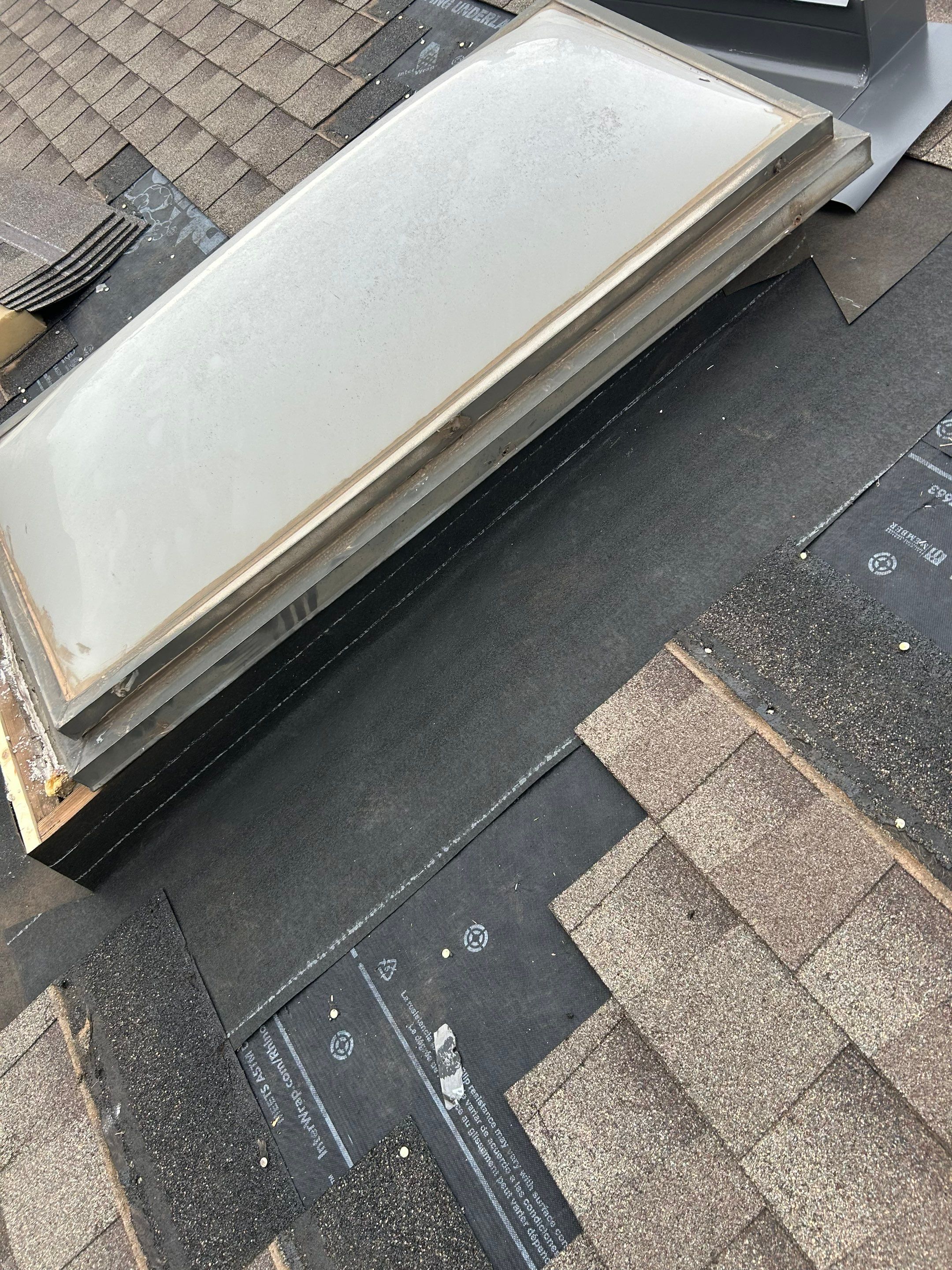 Roof Replacement & Skylight Project in Edmond, OK by McCann's Roofing and Construction