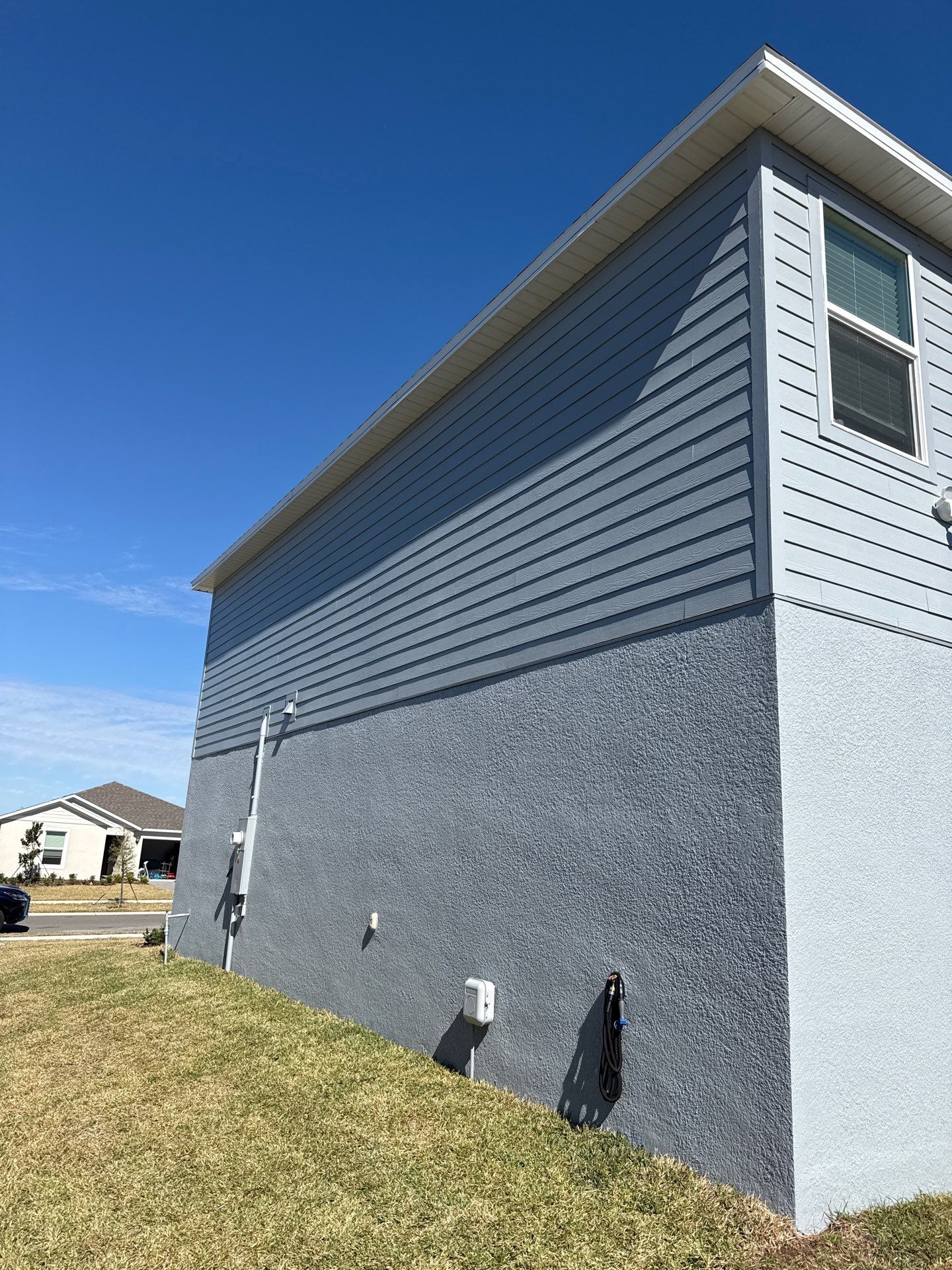 White Down Spouts and Seamless Gutters using downspouts in Dade City FL by Gutter Professors