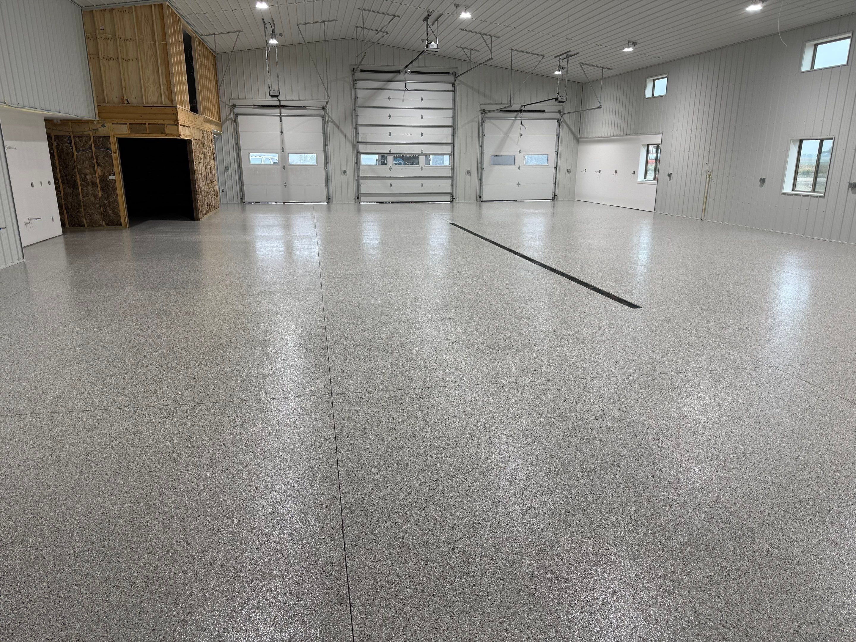 Custom Speckled Floor Coating for Large Montrose Shop by Select Painting, Coatings & Garage Cabinets