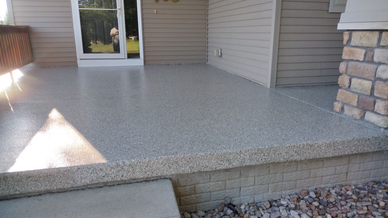 Pebble Beach Front Porch by Revival Concrete Coatings, LLC