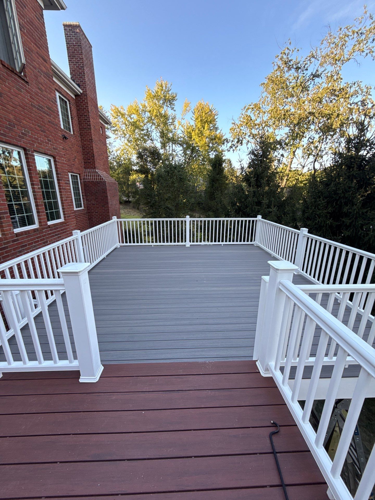 Deck extension  by Cousins Roofing Siding & Decks