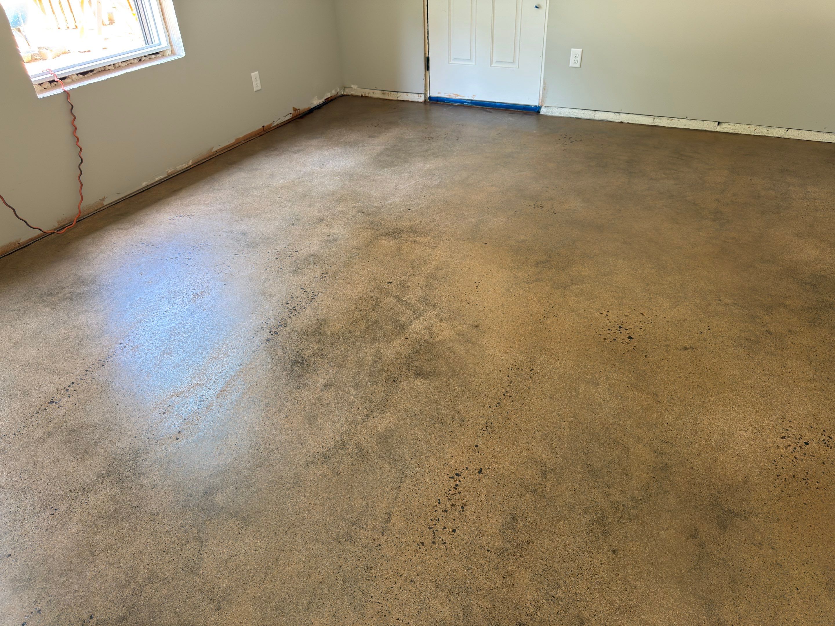 Stained Concrete using Antique Cork by Elite Floor Solutions