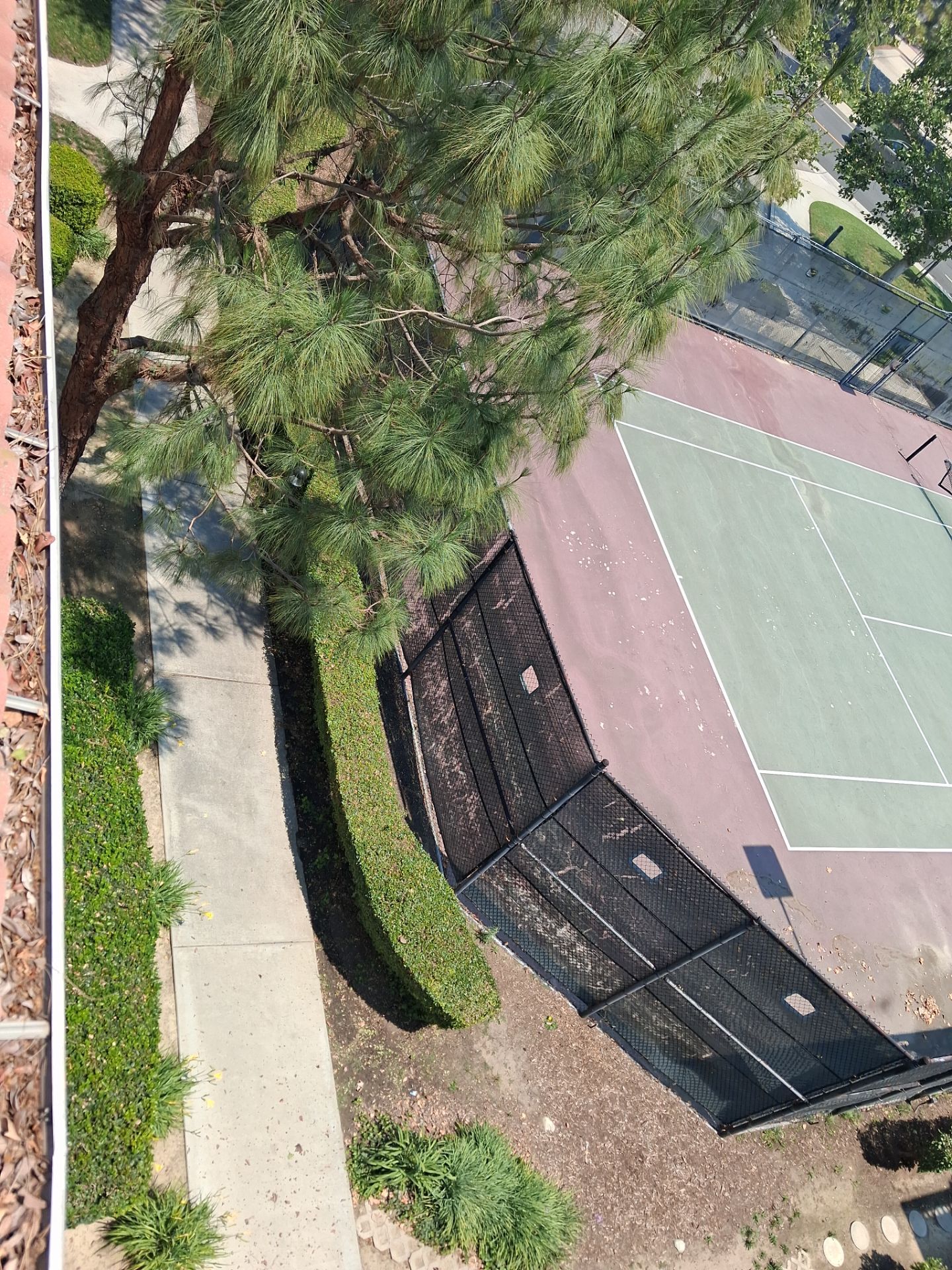 Commercial gutter cleaning Ontario & Rancho Cucamonga, CA before photo with filled gutters