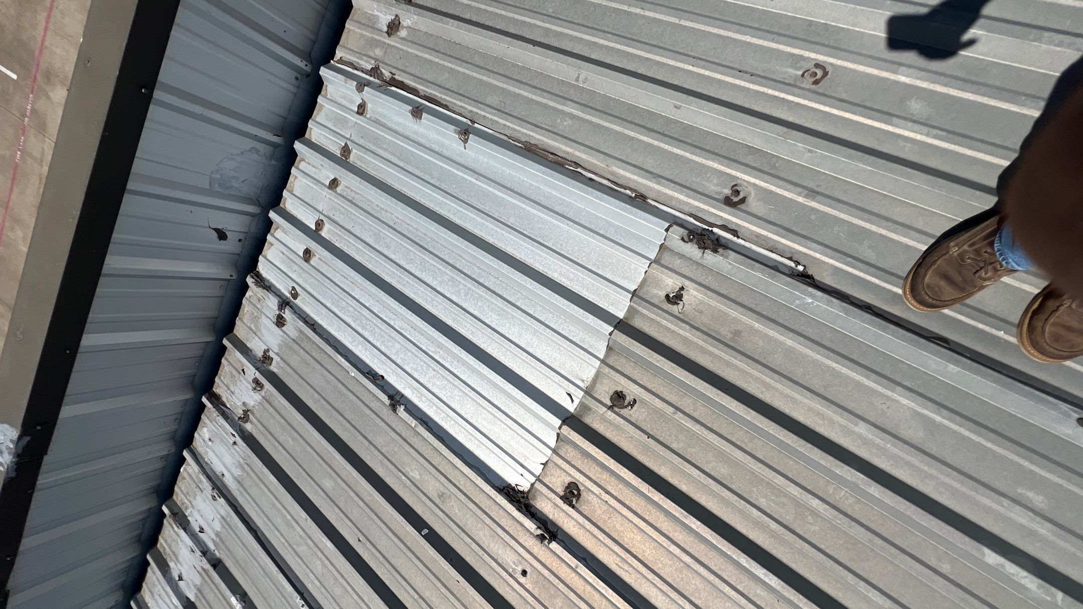 Commercial Roofing Installation using TRP #924 Eterna-Sil Premium Silicone Roof Coating by Harvey Roofing & Construction