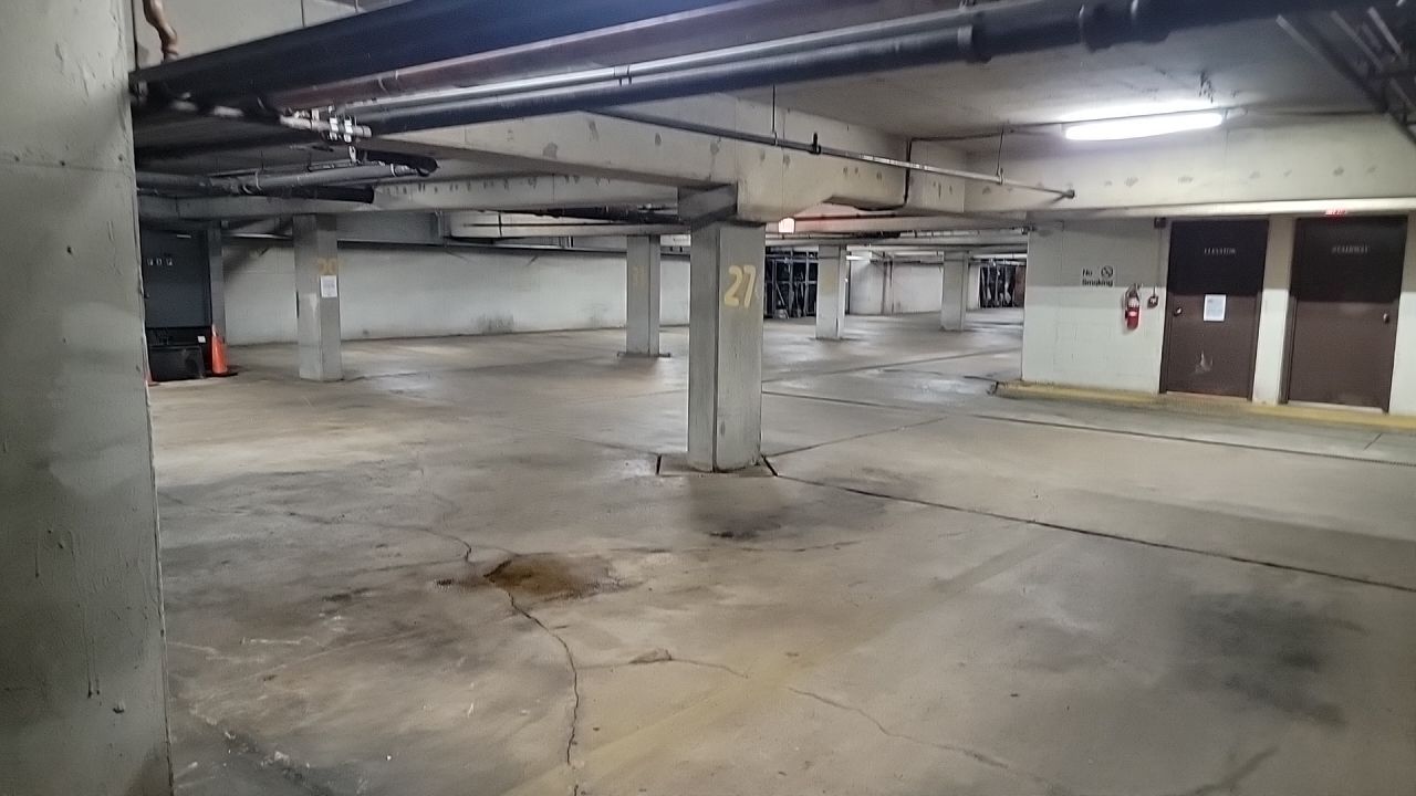 Parking garage using Hot water by Northern Power Washing LLC.