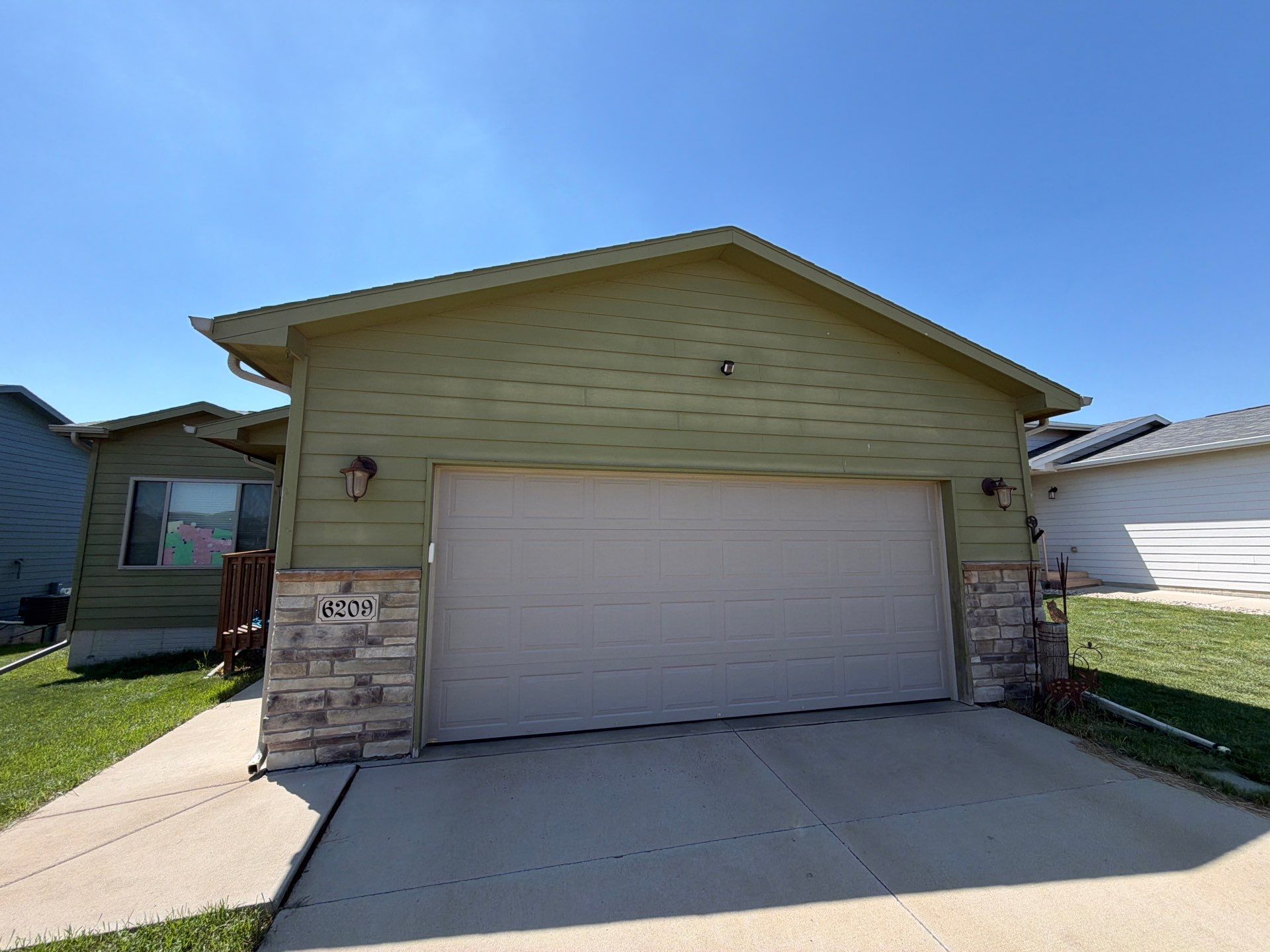 Exterior Painting and Custom Deck Construction in Sioux Falls by Select Painting, Coatings & Garage Cabinets