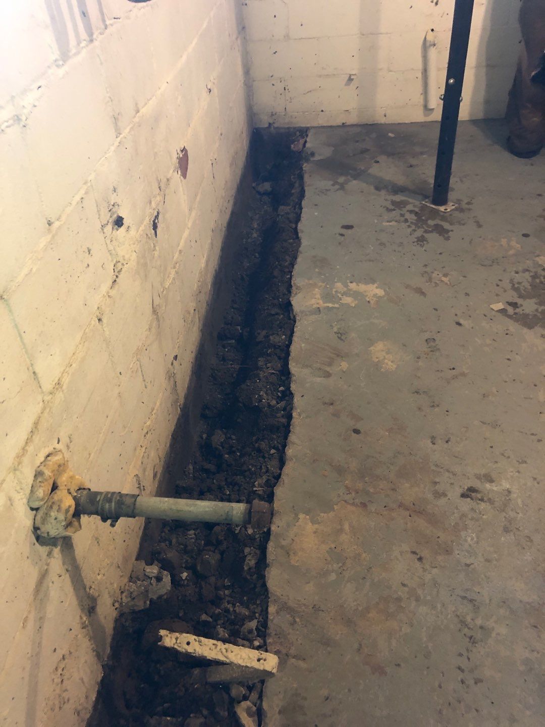 Basement Waterproofing using Drain tile system and a foundation wrap by ACE Waterproofing & Basement Solutions