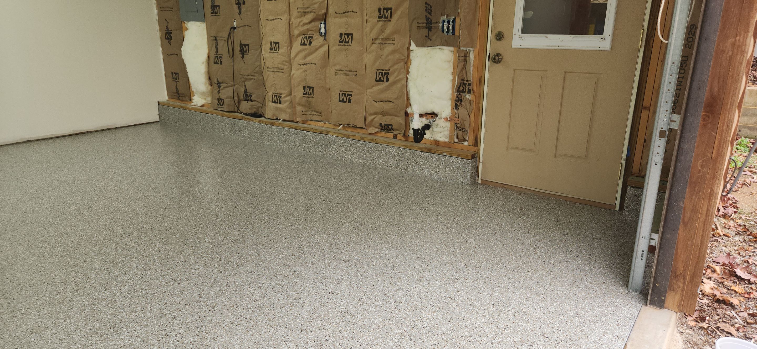Front Porch and Garage using Creekbed by Elite Floor Solutions