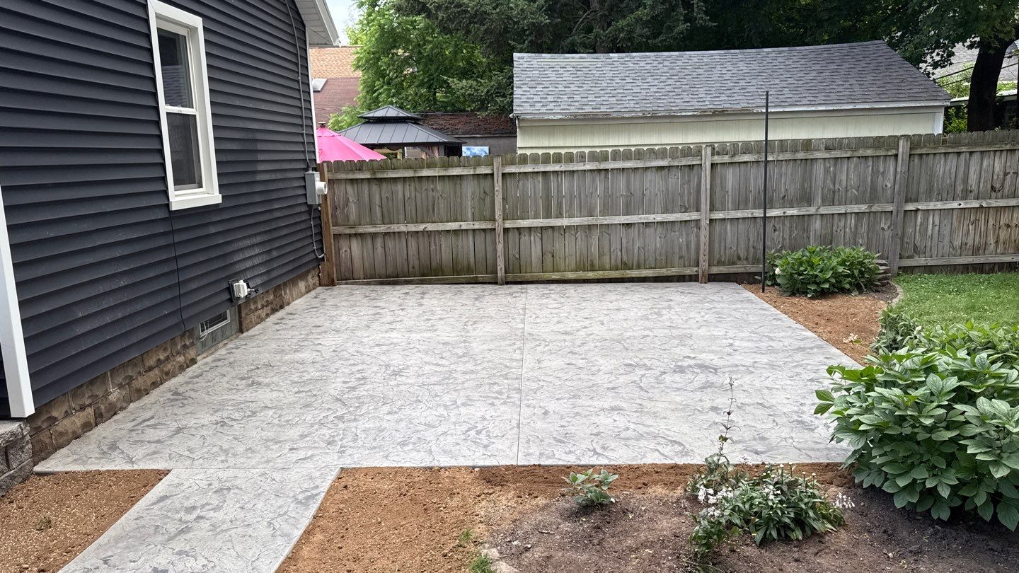 Oxford slate stamped patio and walkway  by NG Masonry & Construction LLC