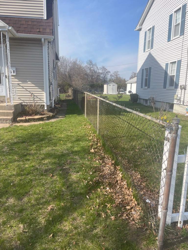 Fence replacement using White Vinyl picket with scalloped edge. by DiGiorgi Roofing and Siding Inc