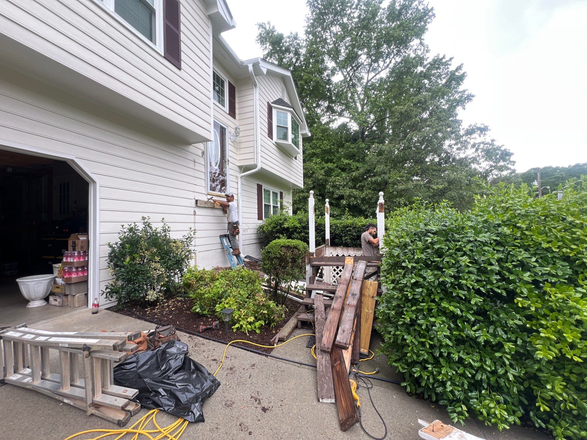 Front Entrance Deck Stair Replacement with White Vinyl Railings in Lawrenceville by Swift Home Renovations