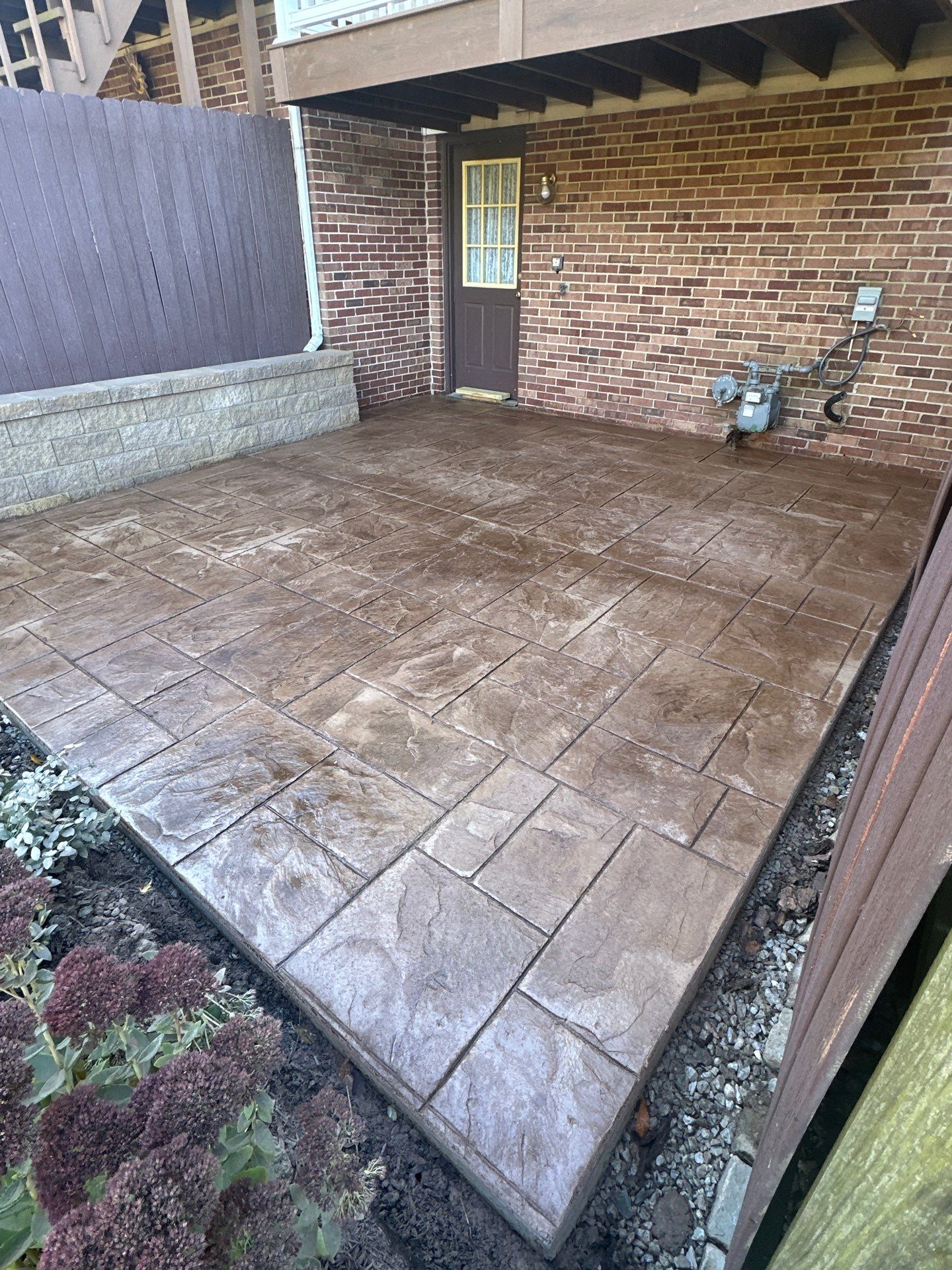 Stamped concrete and redeck  by Cousins Roofing Siding & Decks