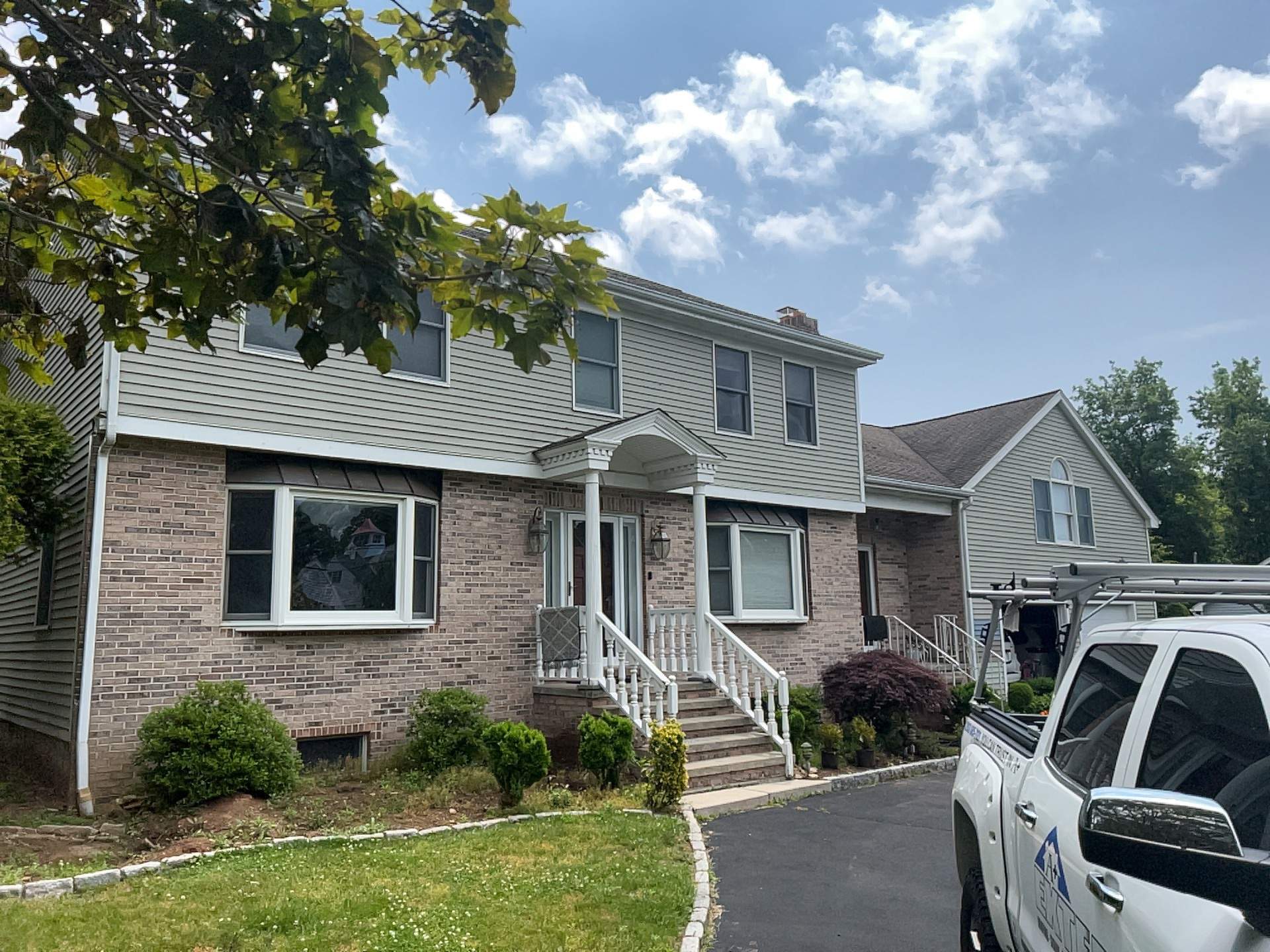 Siding Installation using Mainstreet Colonial & White gutters by A Plus Exterior