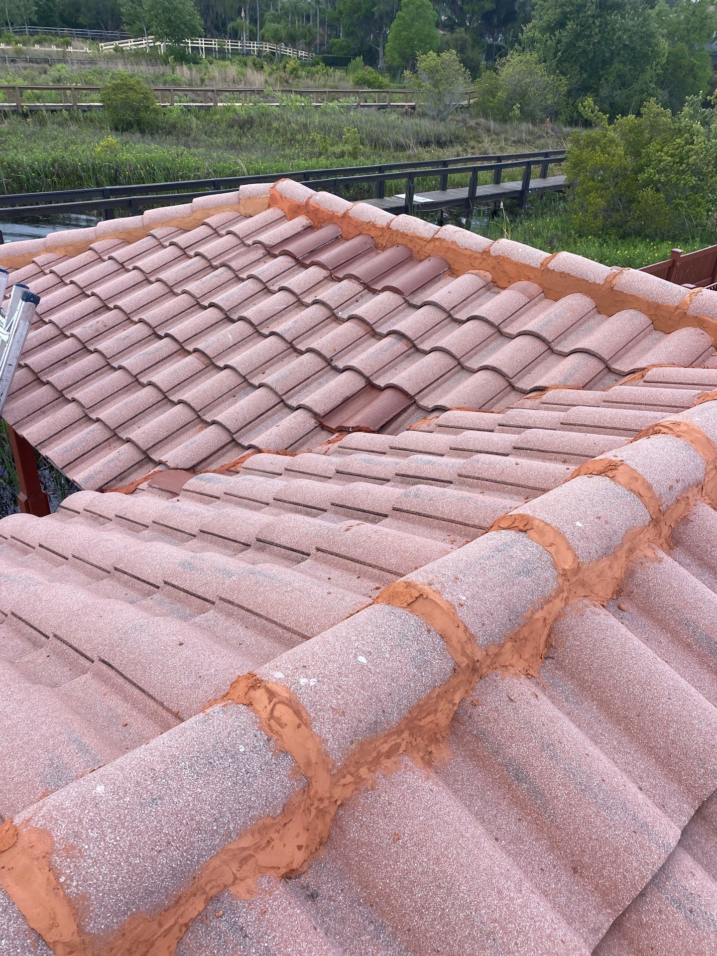 Concrete Tile Roof Repair and Ridge Cap Mortar Sealing in Orlando by Tip Top Roofing Co., Inc.