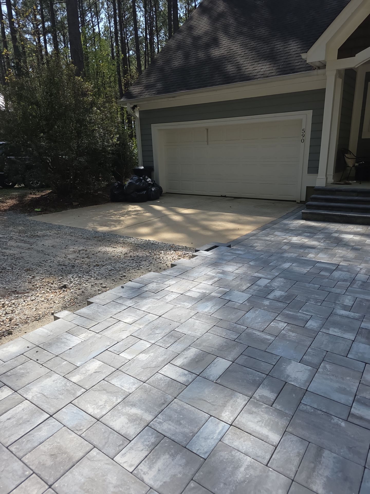 Pittsboro Outdoor Living Transformation – Retaining Wall, Paver Patio & Elevated Deck by Elite Remodeling and Design LLC