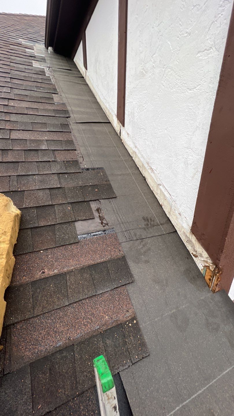 Step flashing repair on roof to wall by Pro Home Services Inc