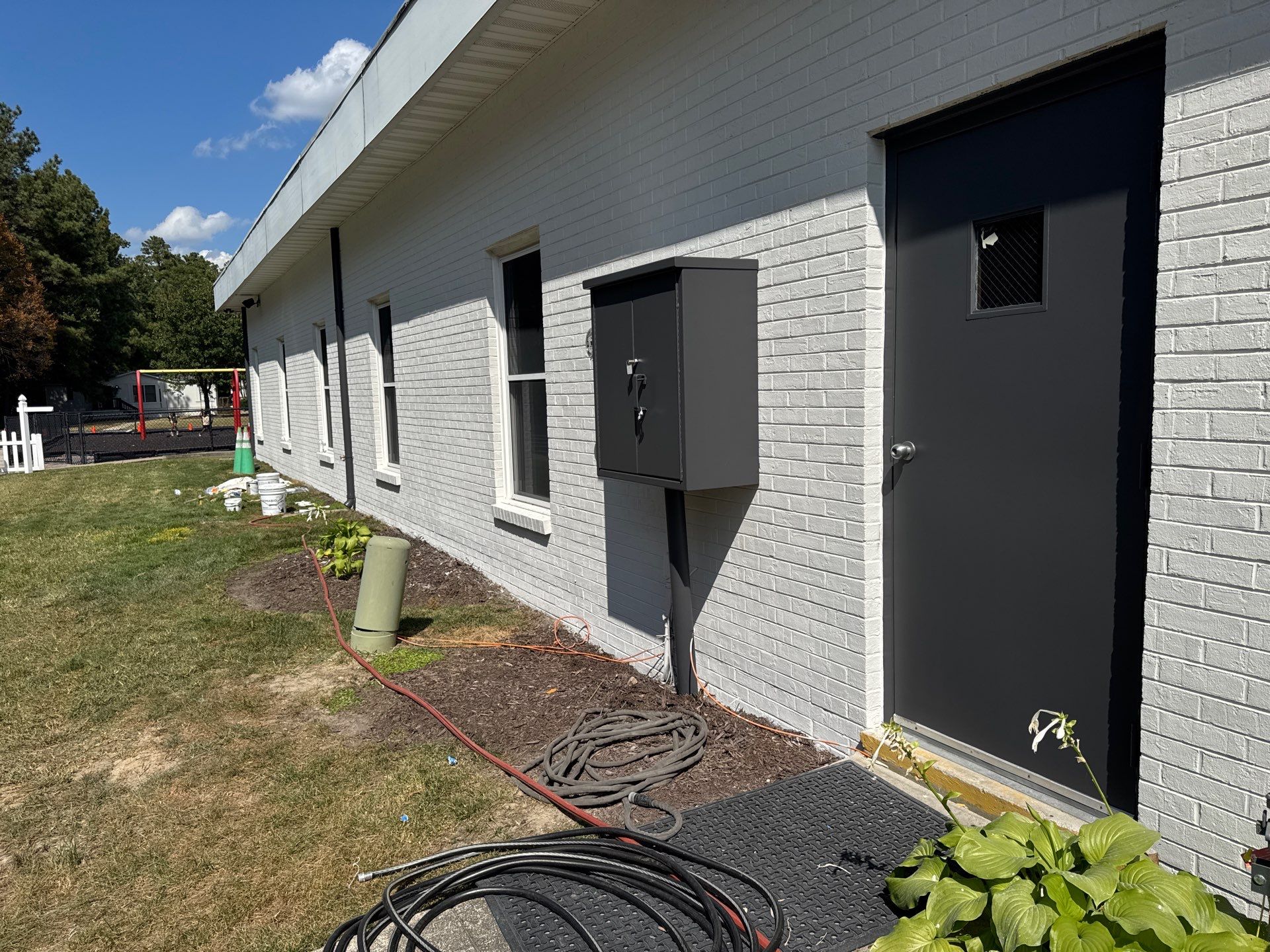 Church Exterior Brick Painting with Romabio Masonry Flat by Highfill Painting