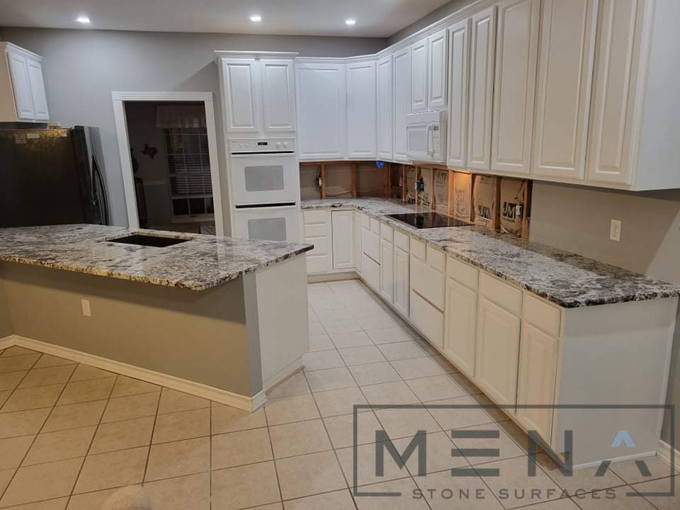 Kitchen countertops using White Normandy Granite by Mena stone surfaces