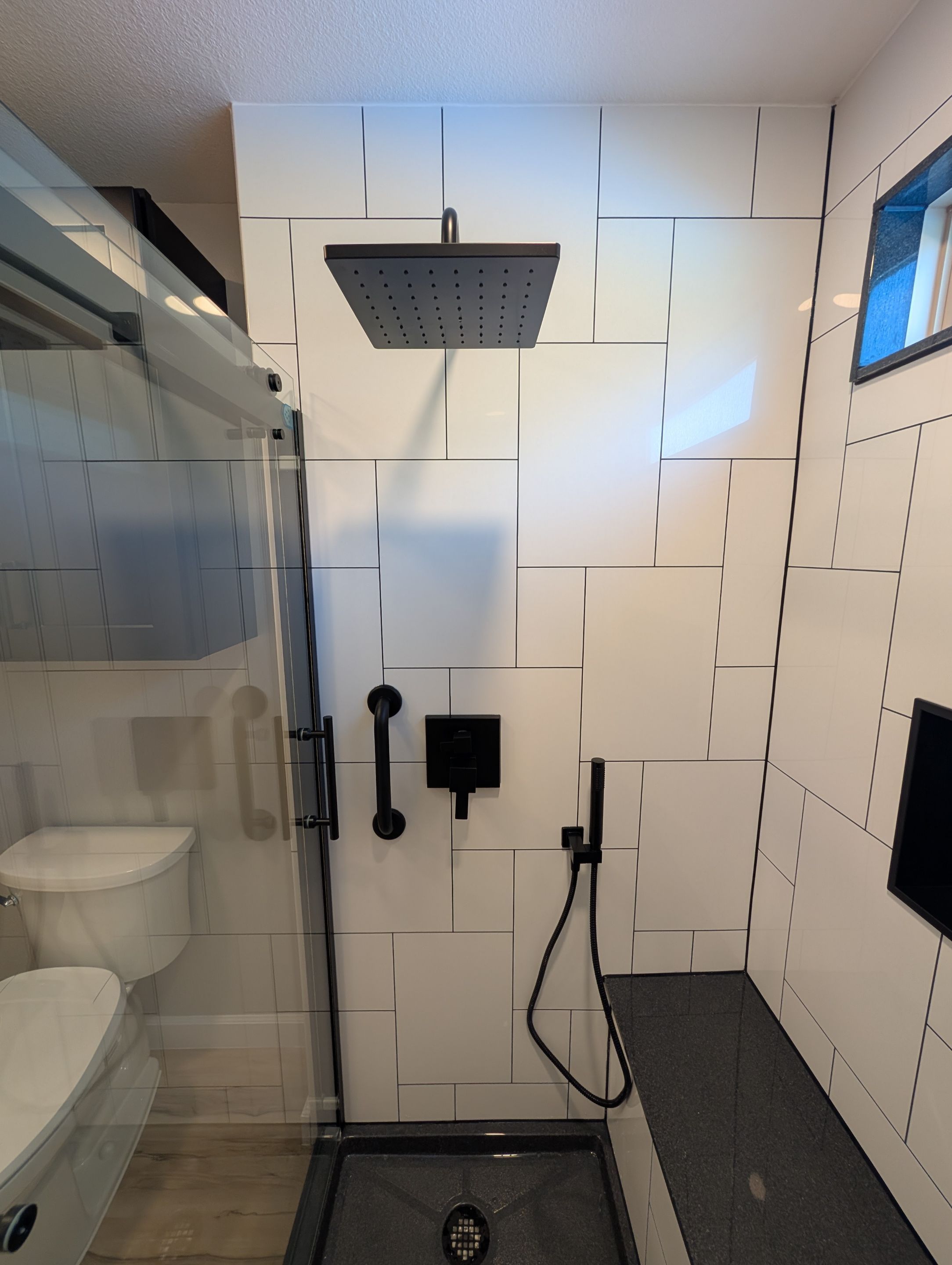 Universal City Tub-to-Shower Conversion with Built-In Bench and Backlit Mirror by Legacy Bath and Kitchen 