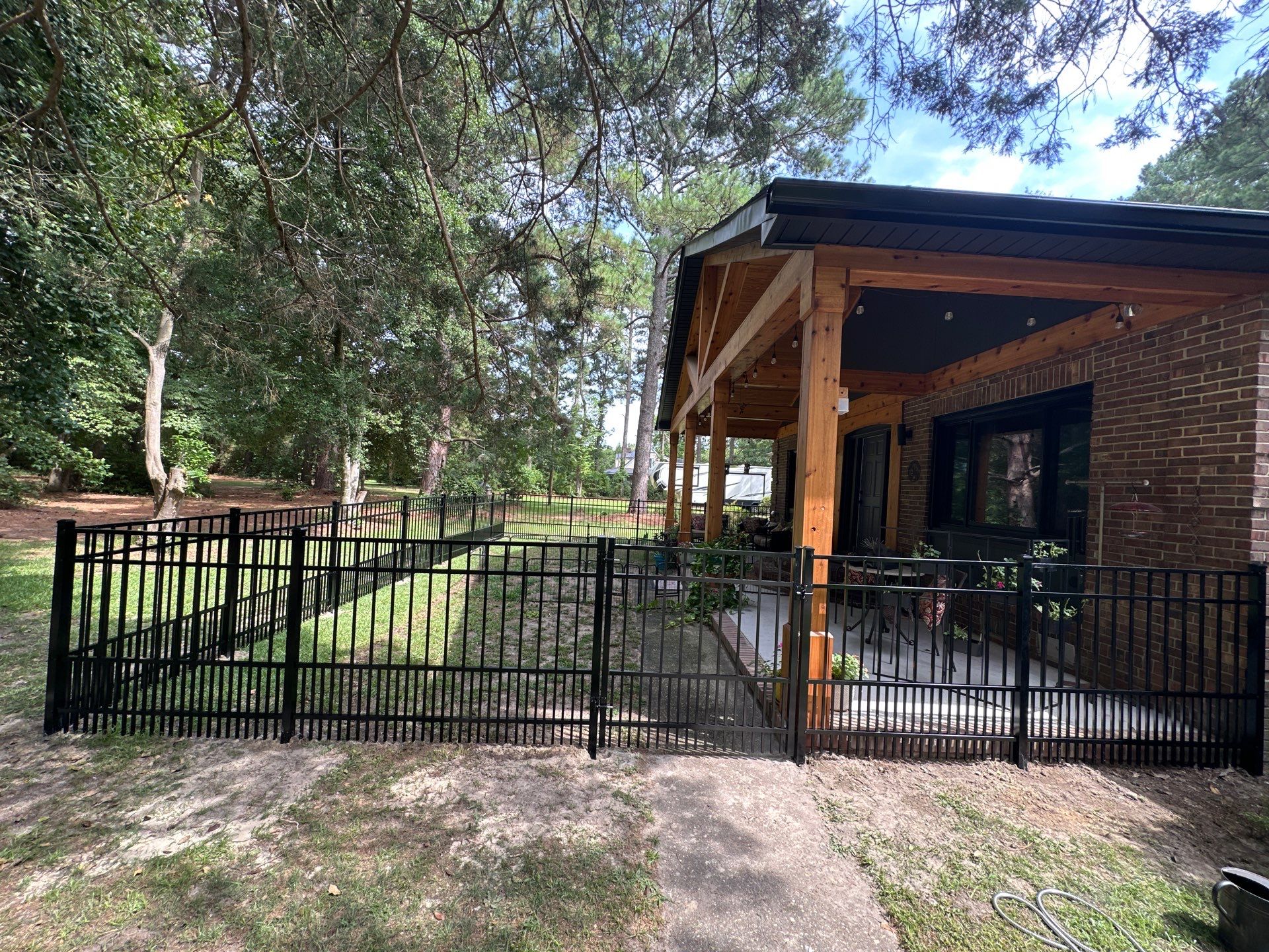 Black Vinyl Privacy Fence with Puppy Picket Aluminum Installation in Roseboro by Superior Fence and Rail