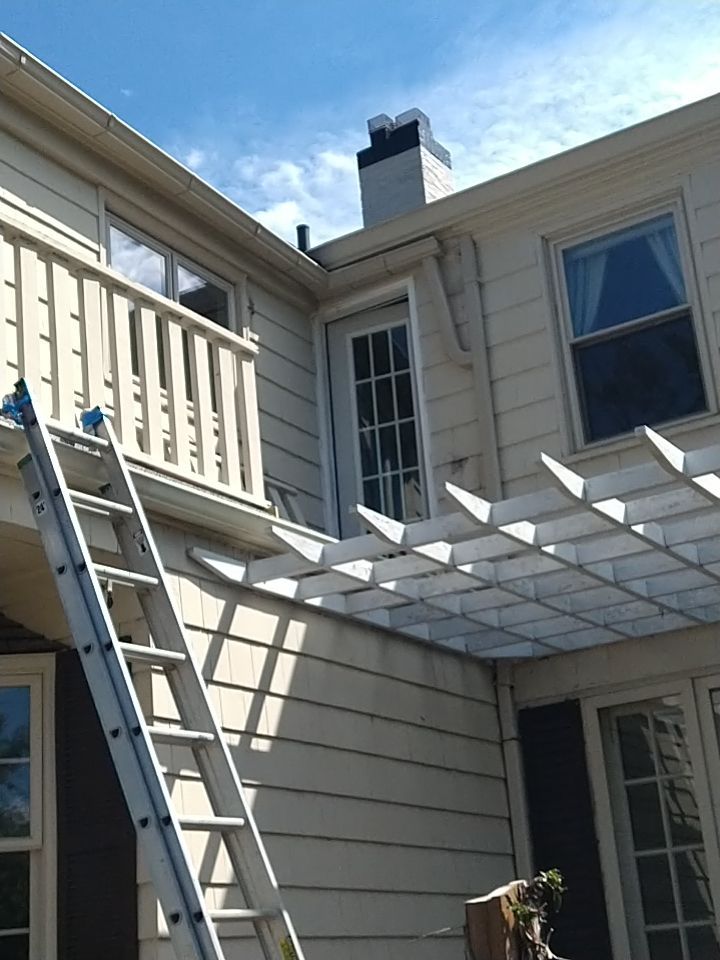Residential Roofing Installation, Dec-tek walk-out porch roof, siding on garage by Absolute Roofing and Construction