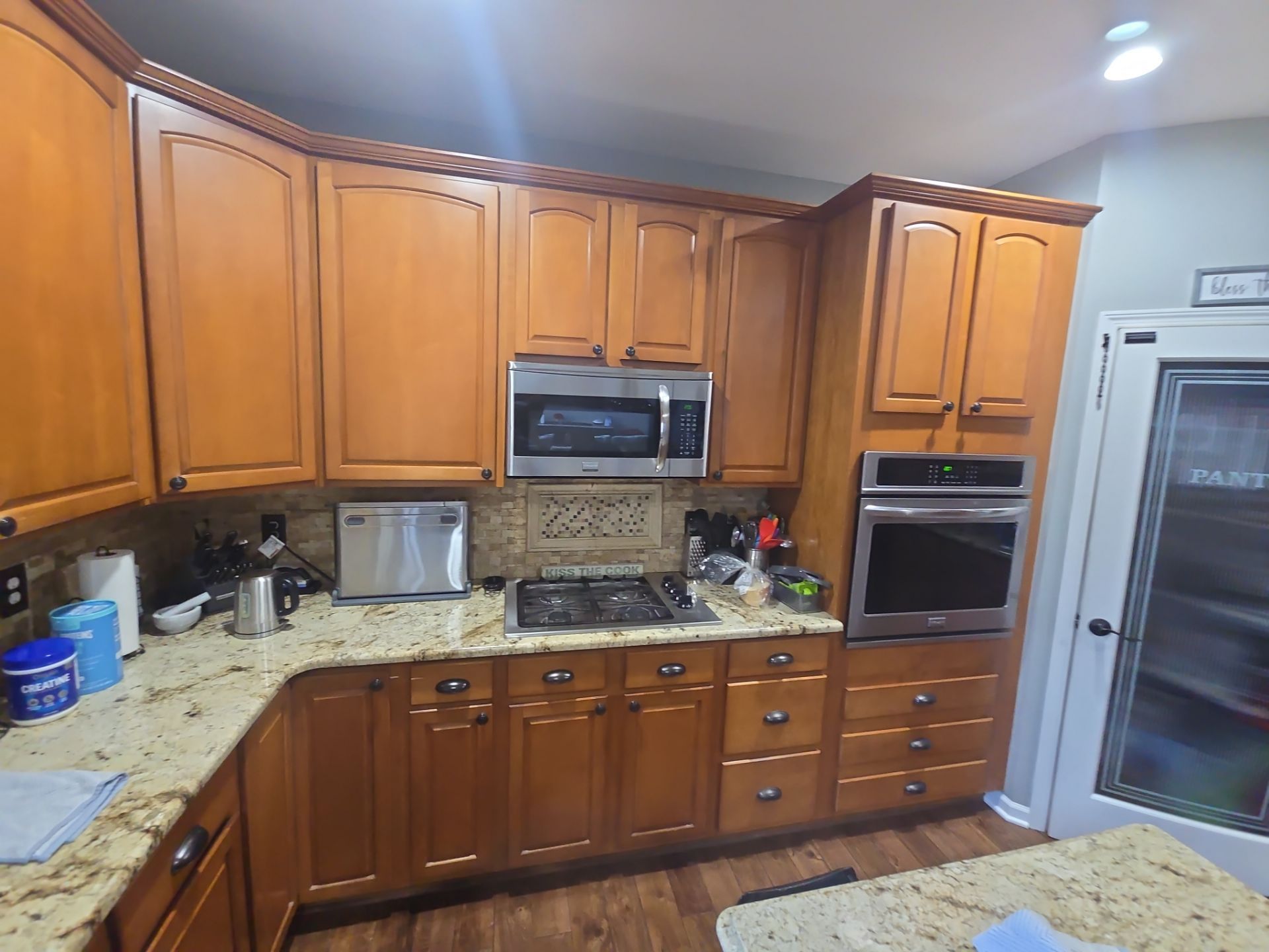 Kitchen Cabinet Refinishing by Top Shelf Painter